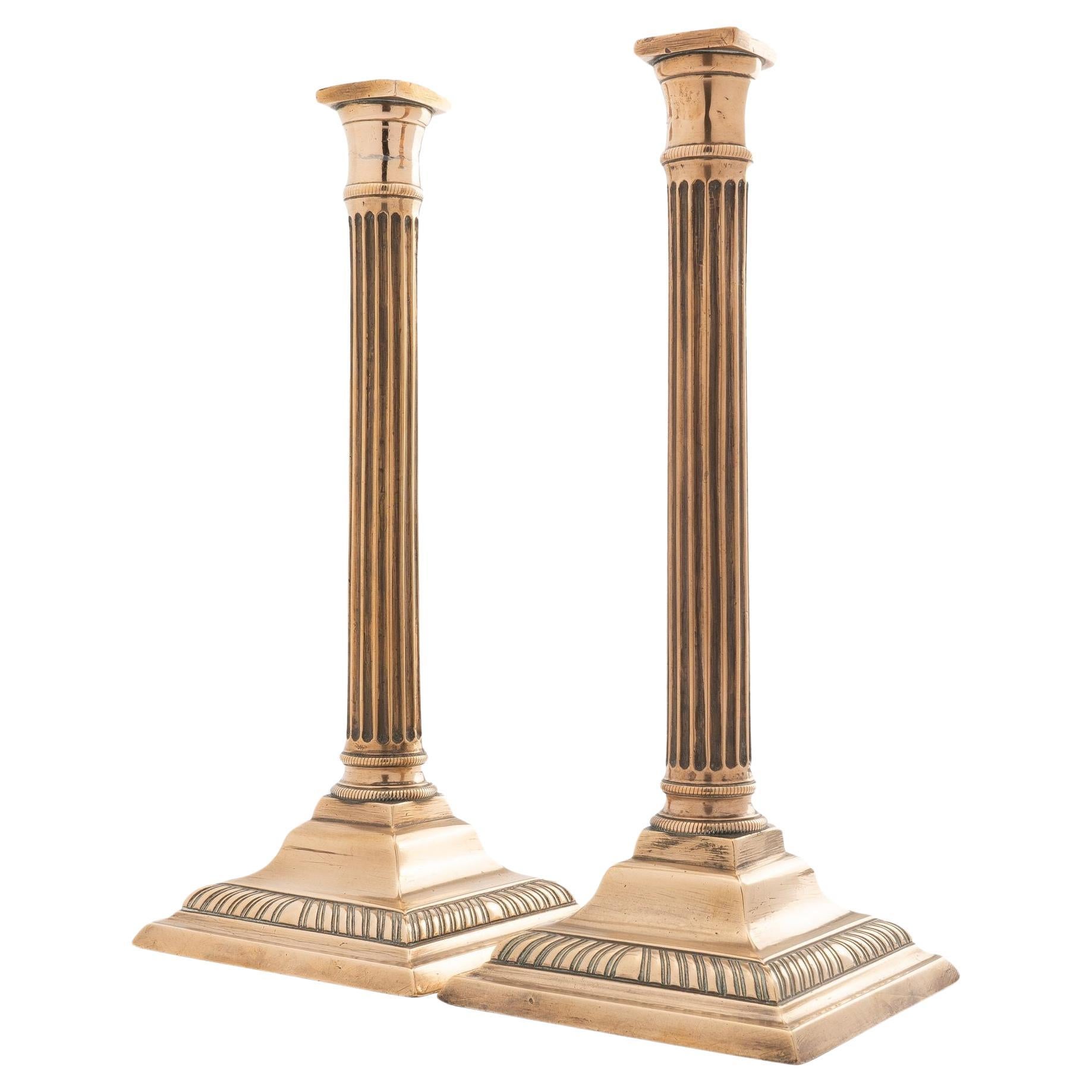 Pair of English cast brass columnar candlesticks, c. 1790 For Sale