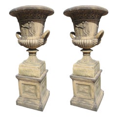 Pair of English Cast Neoclassical Garden Urns on Plinths