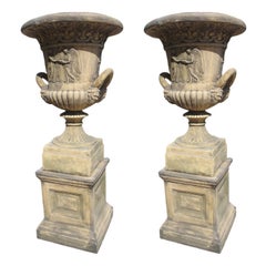 Pair of English Cast Neoclassical Garden Urns on Plinths
