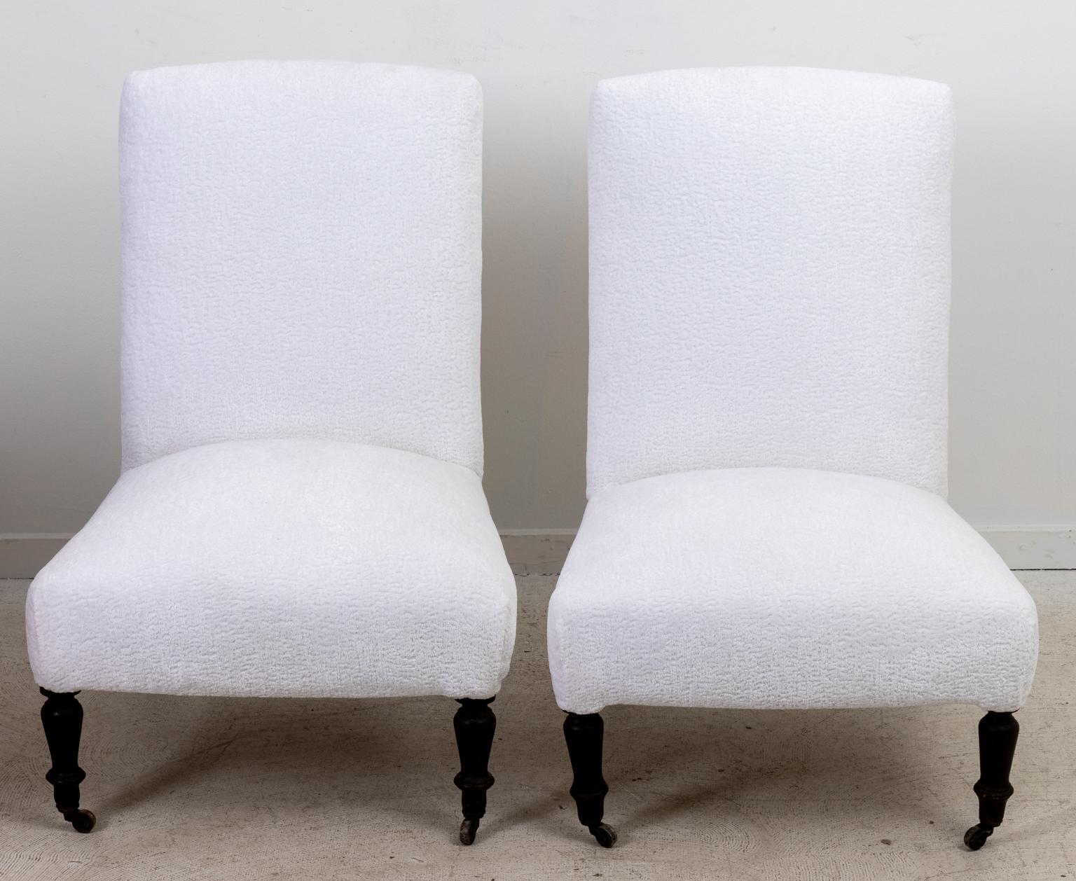 Circa 1880s pair of English Country House style chairs, freshly upholstered in fabric with ring turned legs on castors. Made in England. Please note of wear consistent with age.