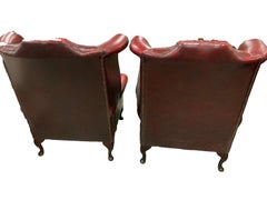 Pair of English Chesterfield Button-Tufted Leather Club Armchairs in Oxblood Red
