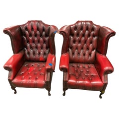 Pair of English Chesterfield Button-Tufted Leather Club Armchairs in Oxblood Red