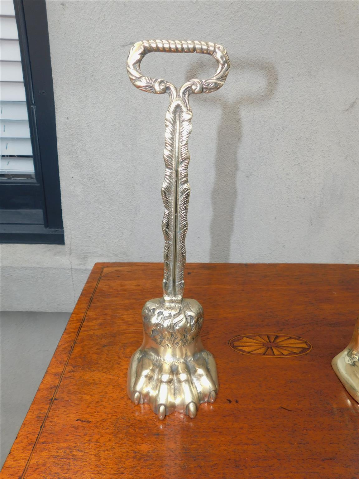 Pair of English Chippendale Brass Lion Paw Doorstops with Oval Handles, C. 1780 In Excellent Condition For Sale In Charleston, SC