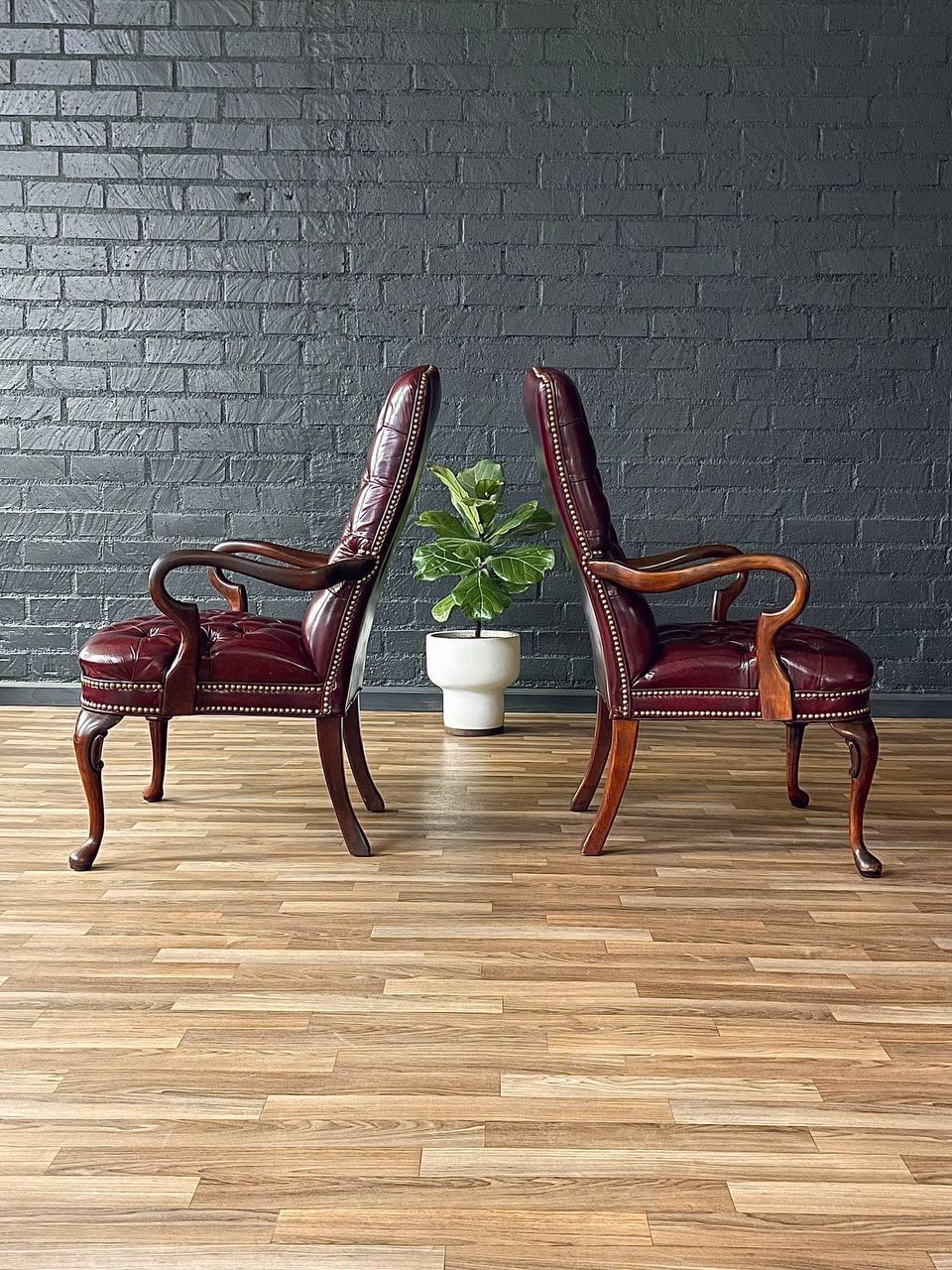Brass Pair of English Chippendale Style Button Tufted Leather Arm Chairs