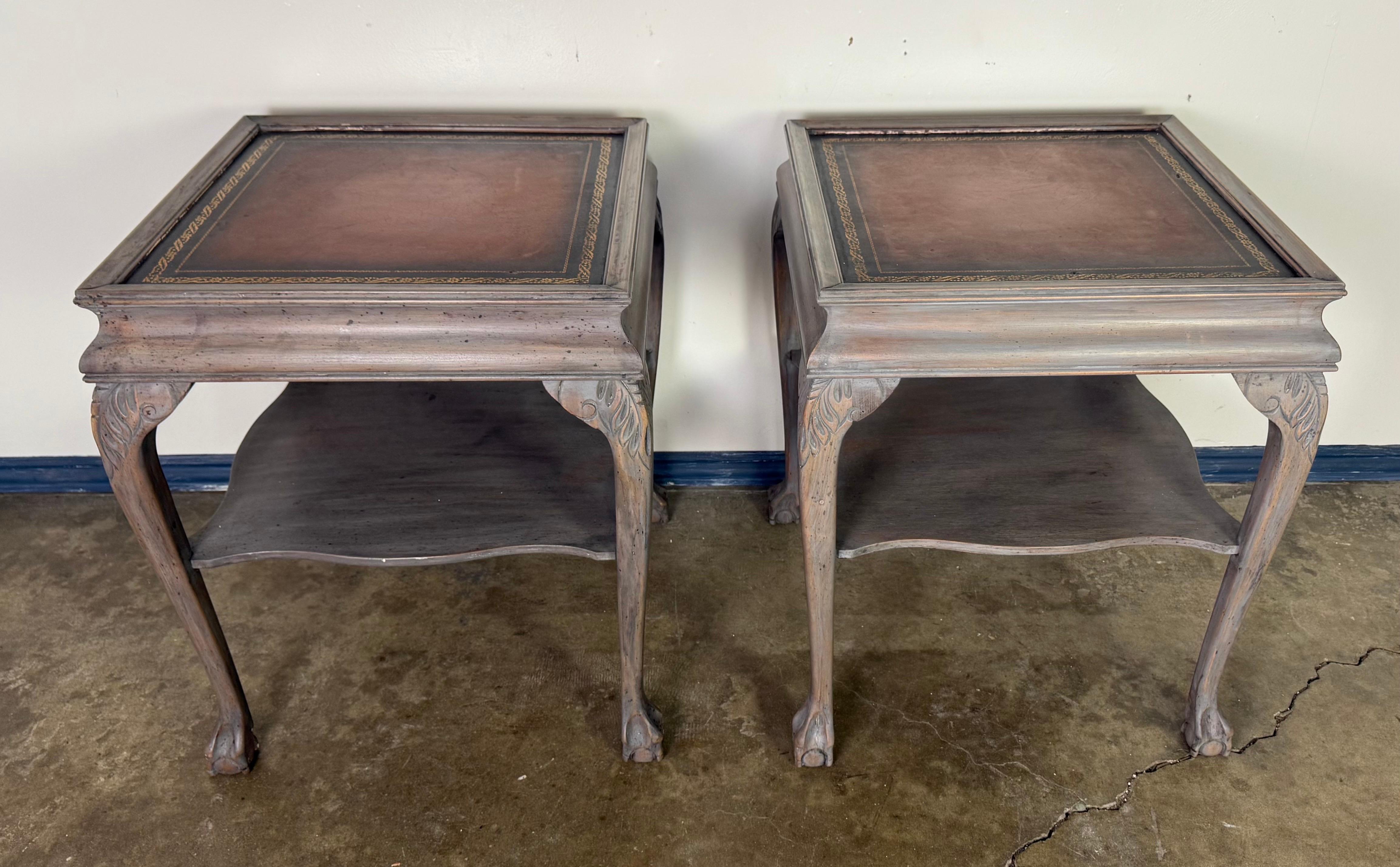 Pair of English Style Painted End Tables with Tooled Leather Tops and Chippendale legs.

A charming pair of mid-20th century Chippendale style end tables featuring hand-tooled leather tops and elegantly carved cabriole legs. Each table is crafted