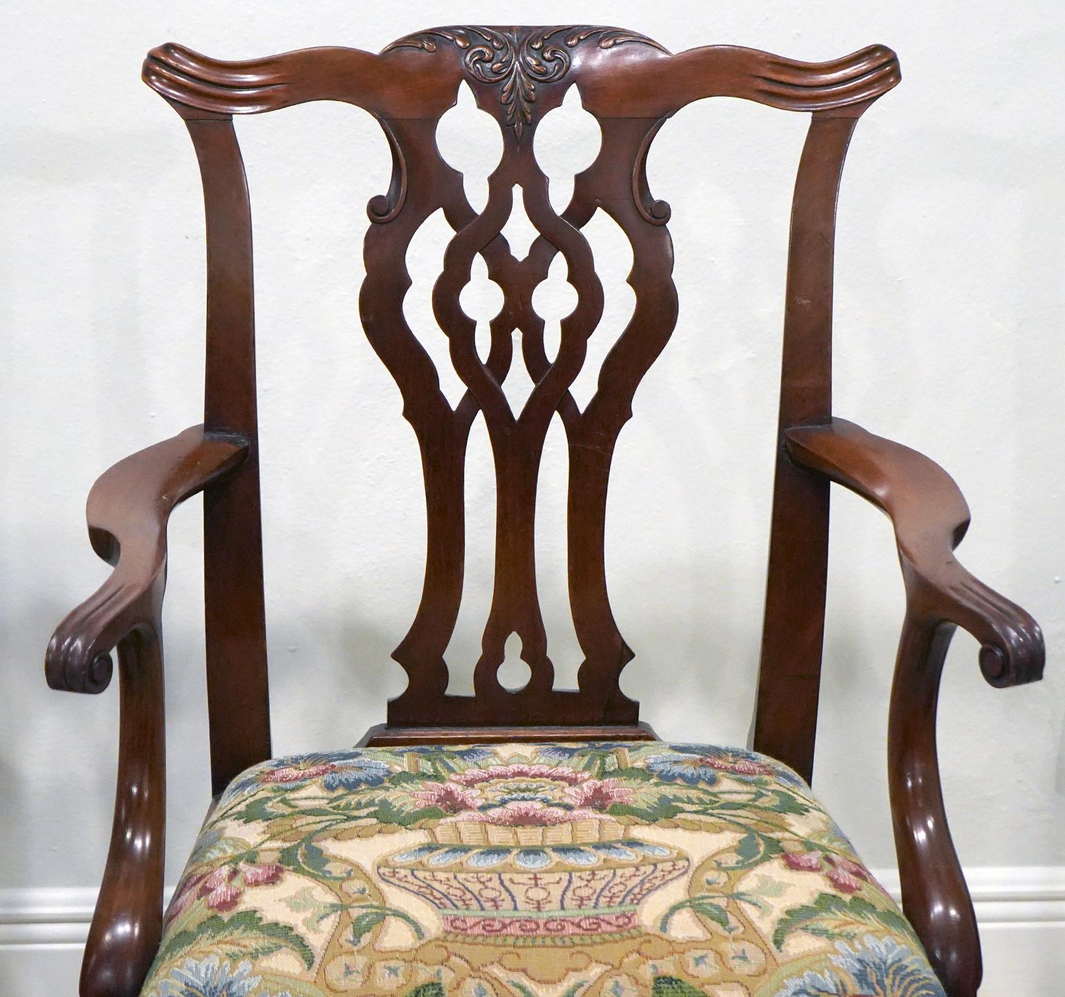 Raised on four square molded legs the rear legs back swept, these stairs feature a seat later recovered with Gobelin style fabric. A great choice. The carved and curved armrests, the fretwork style splat and the carved crest rail are in the