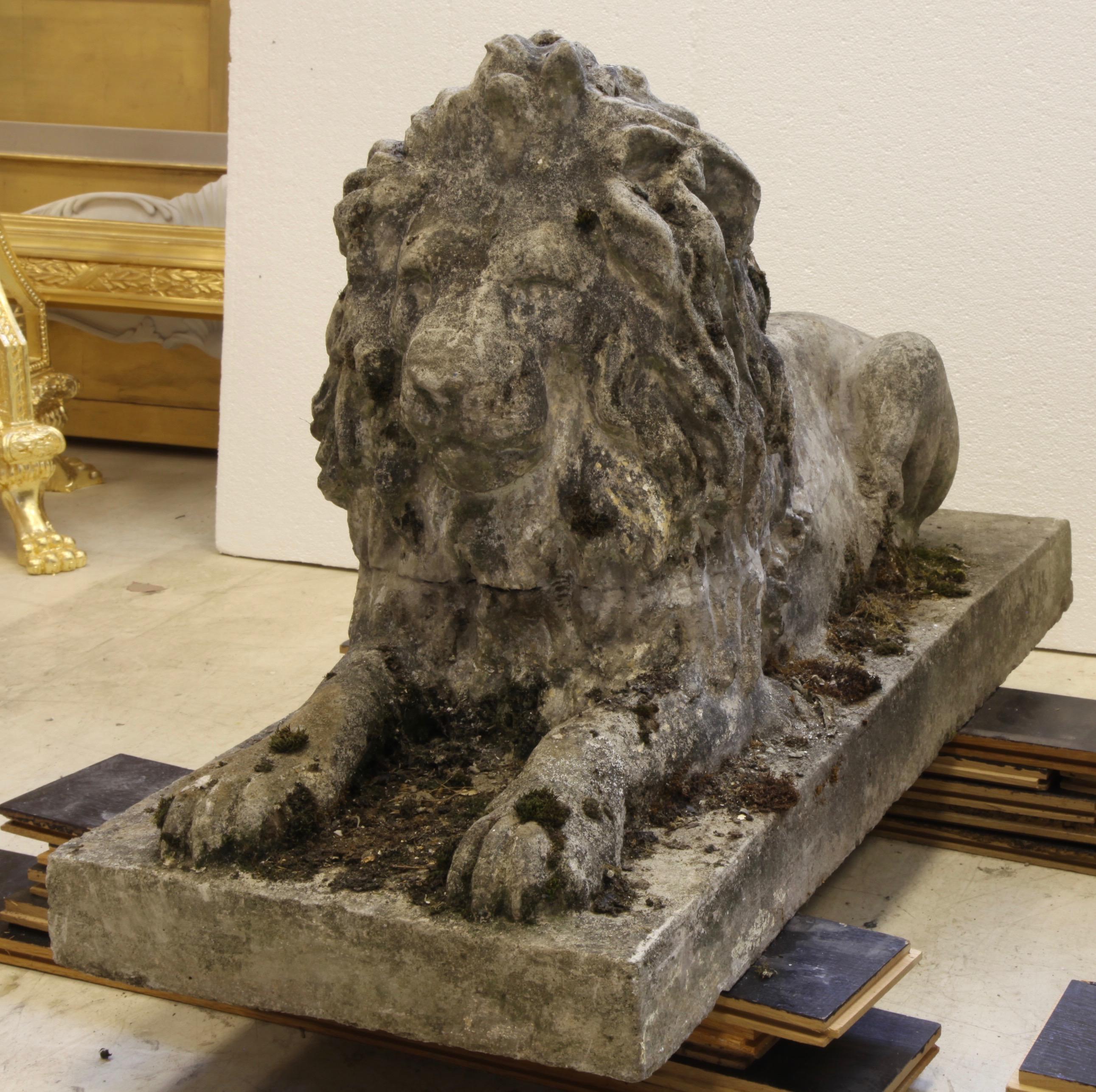 Pair of English composite stone lions. The intricate details can be seen throughout, circa 1930s.