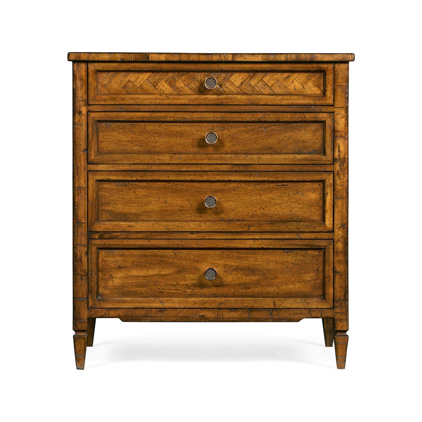 A pair of English Country walnut four-drawer bedside chests of drawers with a rustic antiqued finish, a herringbone form parquetry inlaid top drawer on square tapered legs. 

Dimensions: 26