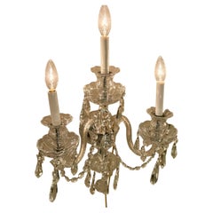 Pair of English cut crystal three light wall sconces with pendants