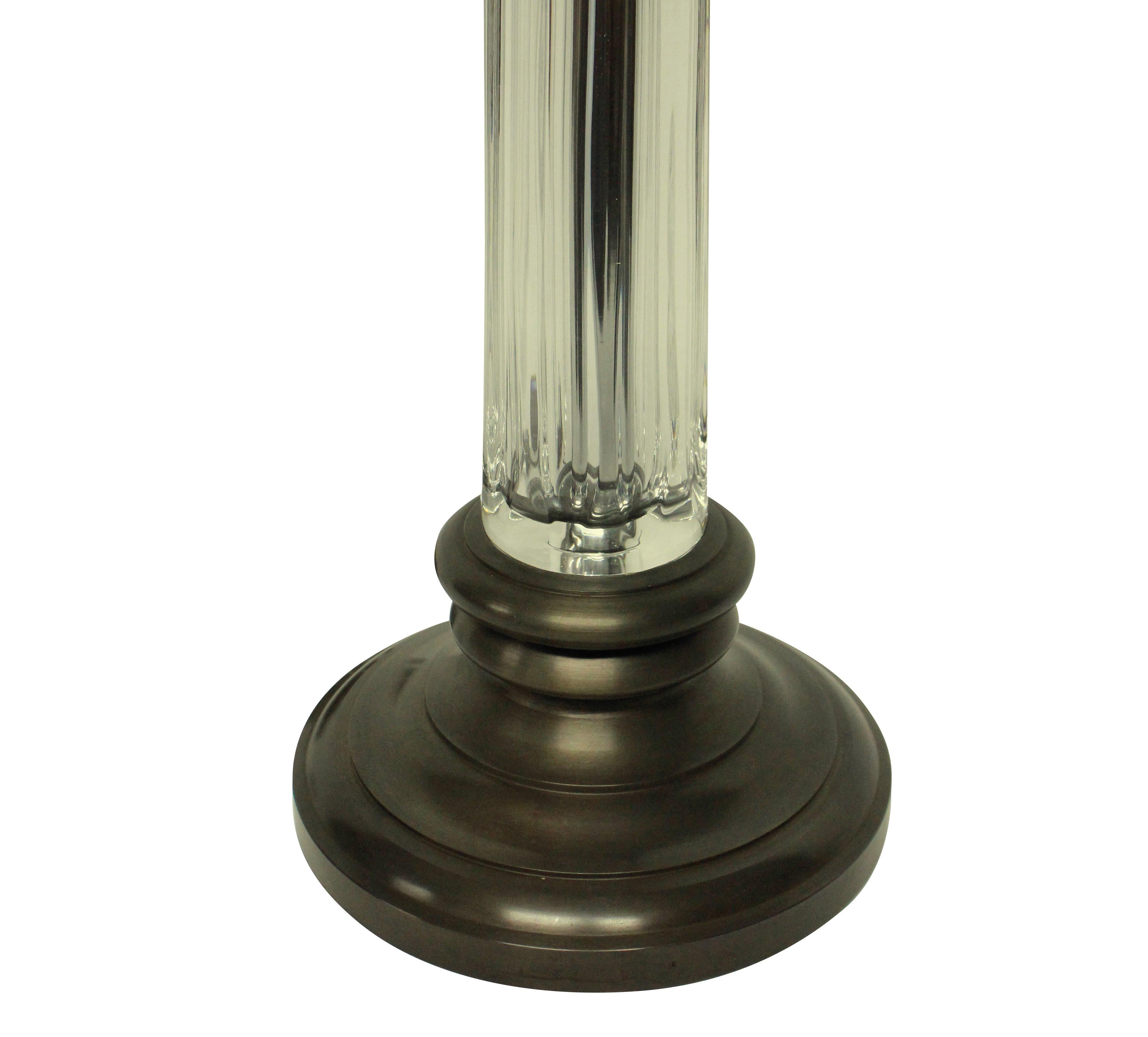 A pair of English cut-glass column lamps with bronzed bases and fittings. Newly electrified with brown silk cords.

Price here for a pair.
