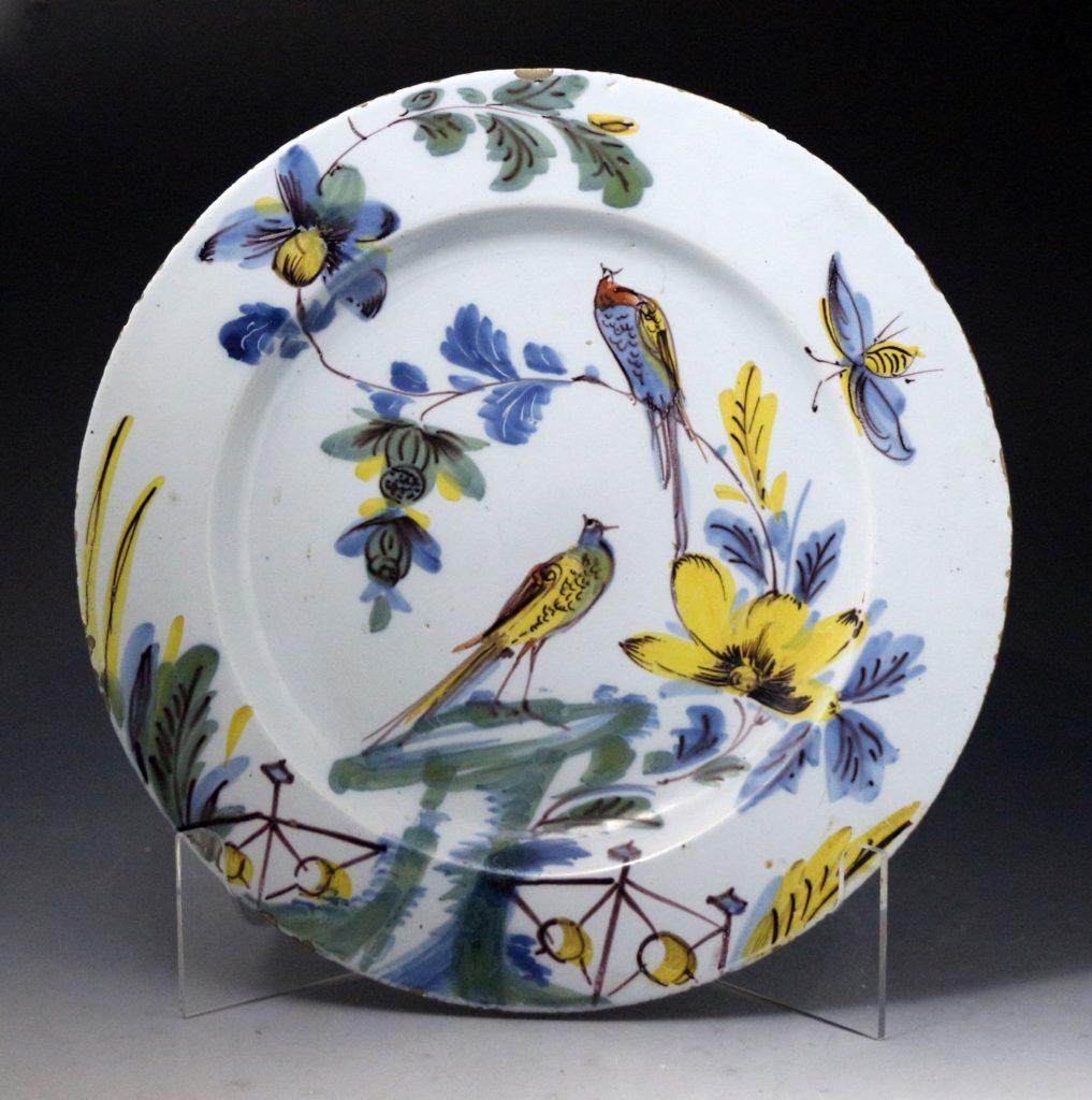 An excellent pair of delftware dishes decorated with birds, flowers, and insects in polychrome colors. The rare pair have wonderful decorative appeal and are the work of the Bristol pottery from the mid-18th century. Bristol, England,