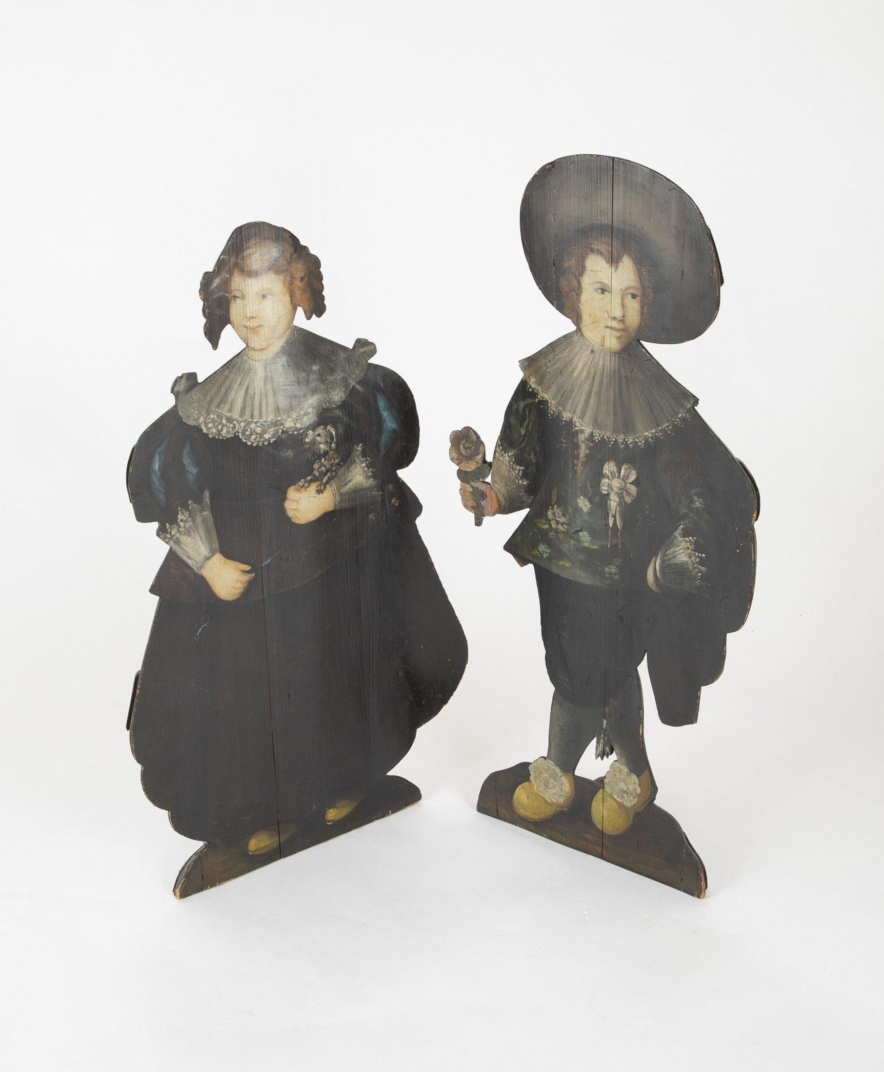 Pair of English painted Dummy boards in the form of a young boy and a young girl, early to mid-19th century.