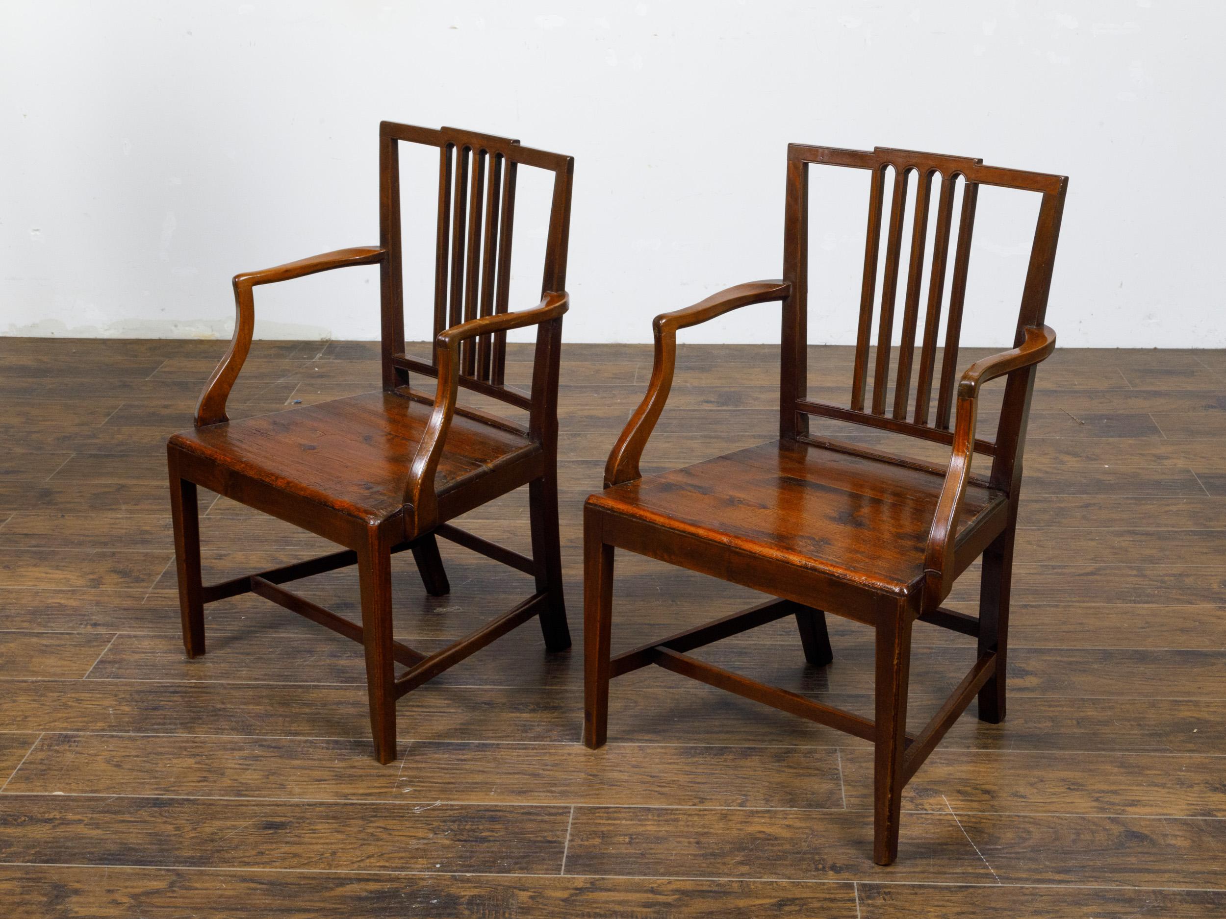 Wood Pair of English Early 19th Century Plank Seat Chairs with Scrolling Arms For Sale