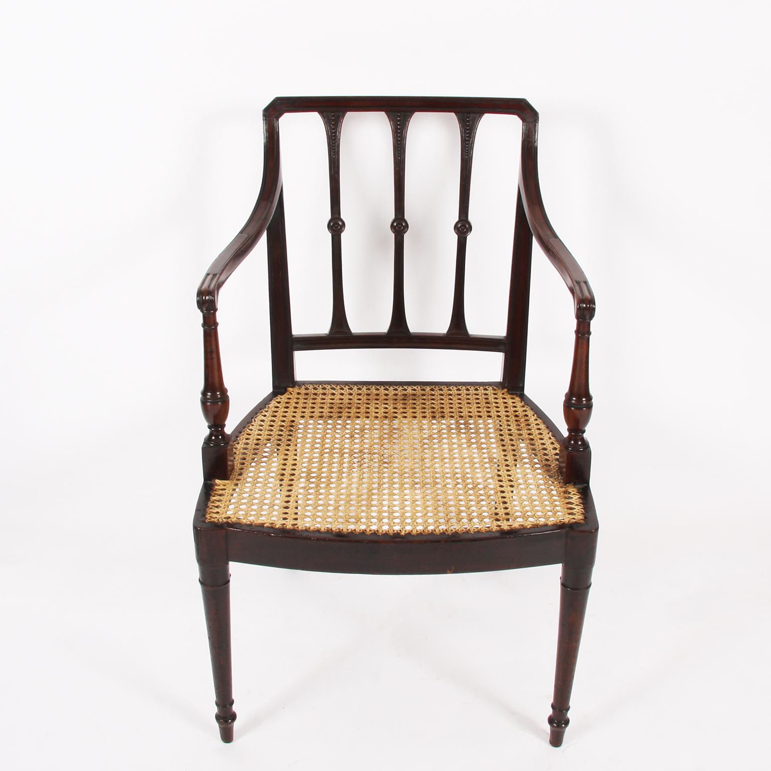 English, early 20th century.

A pair of elegant mahogany caned chairs.