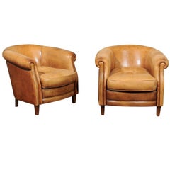 Pair of English Early 20th Century Caramel Leather Club Chairs with Rolled Arms