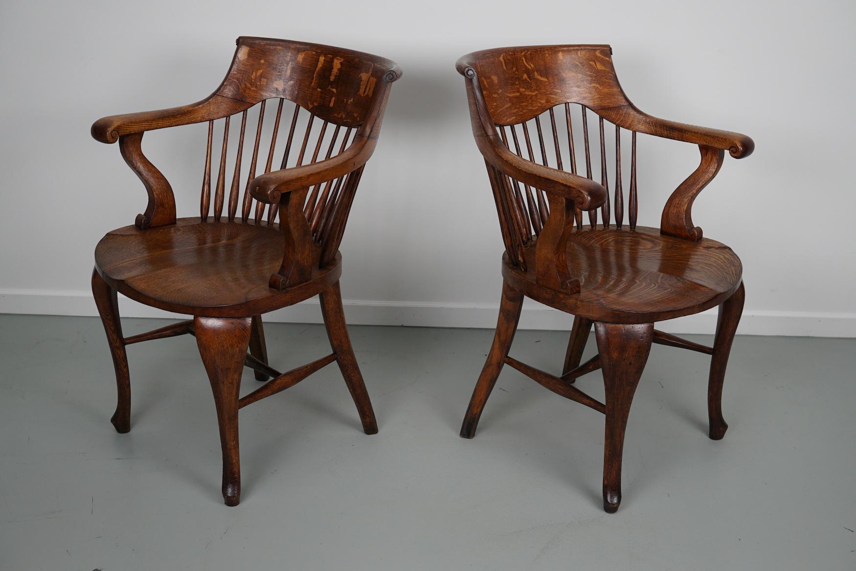 Pair of English Edwardian Oak Spindle Back Captains Office Desk Chairs For Sale 11