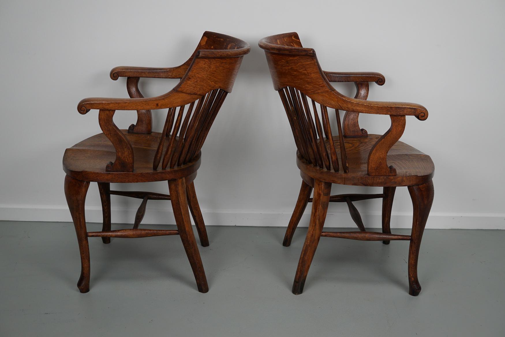 Pair of English Edwardian Oak Spindle Back Captains Office Desk Chairs For Sale 13