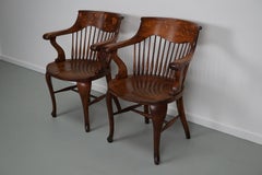 Pair of English Edwardian Oak Spindle Back Captains Office Desk Chairs