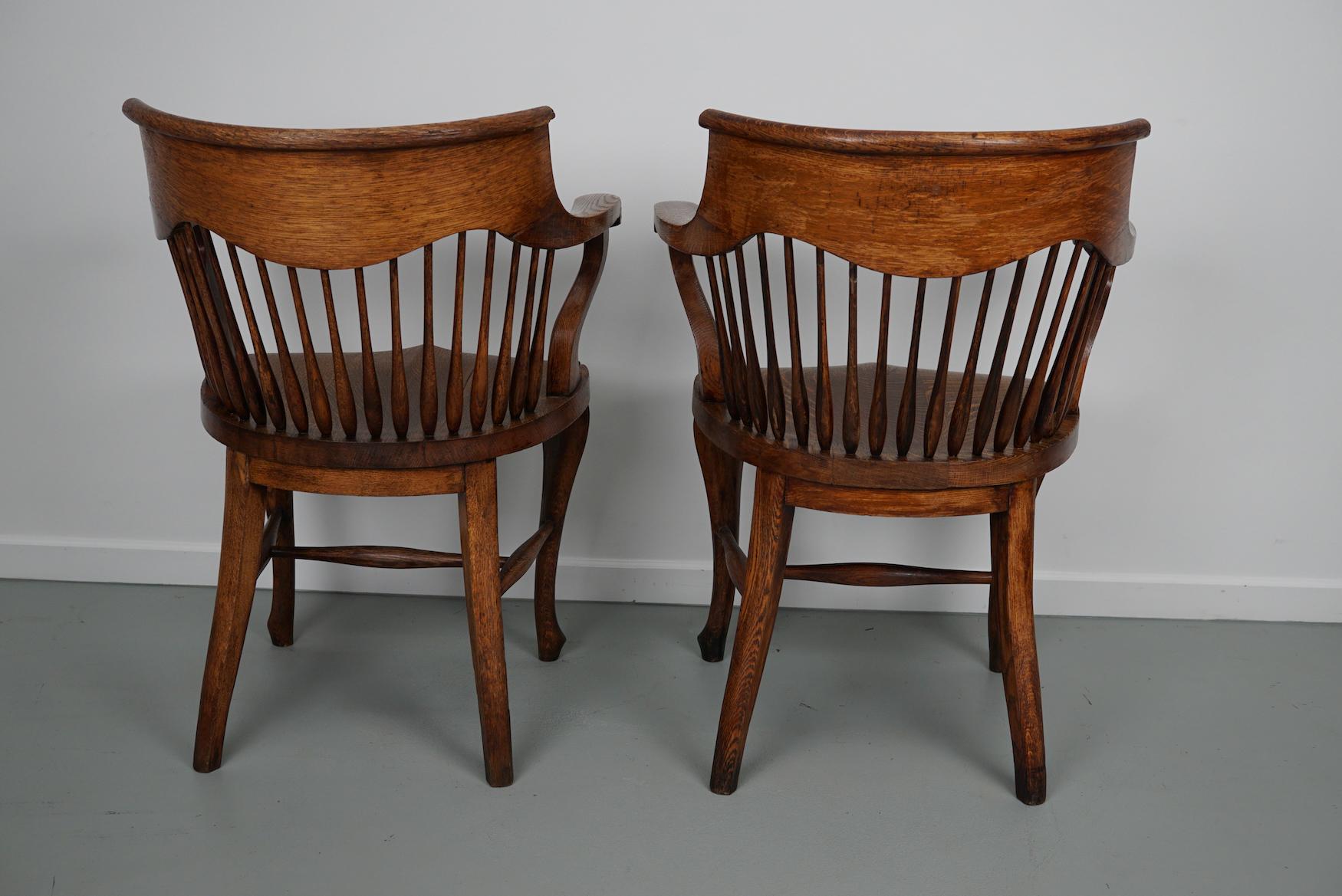 Pair of English Edwardian Oak Spindle Back Captains Office Desk Chairs For Sale 14