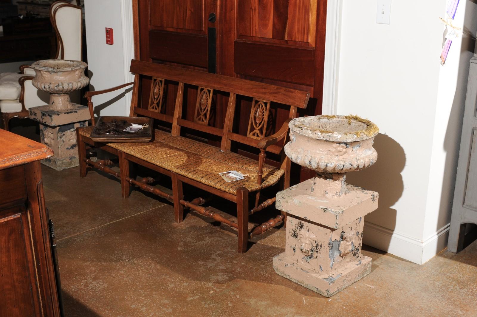 Pair of English Edwardian Period 1900s Reconstituted Stone Urns with Lion Heads In Distressed Condition For Sale In Atlanta, GA