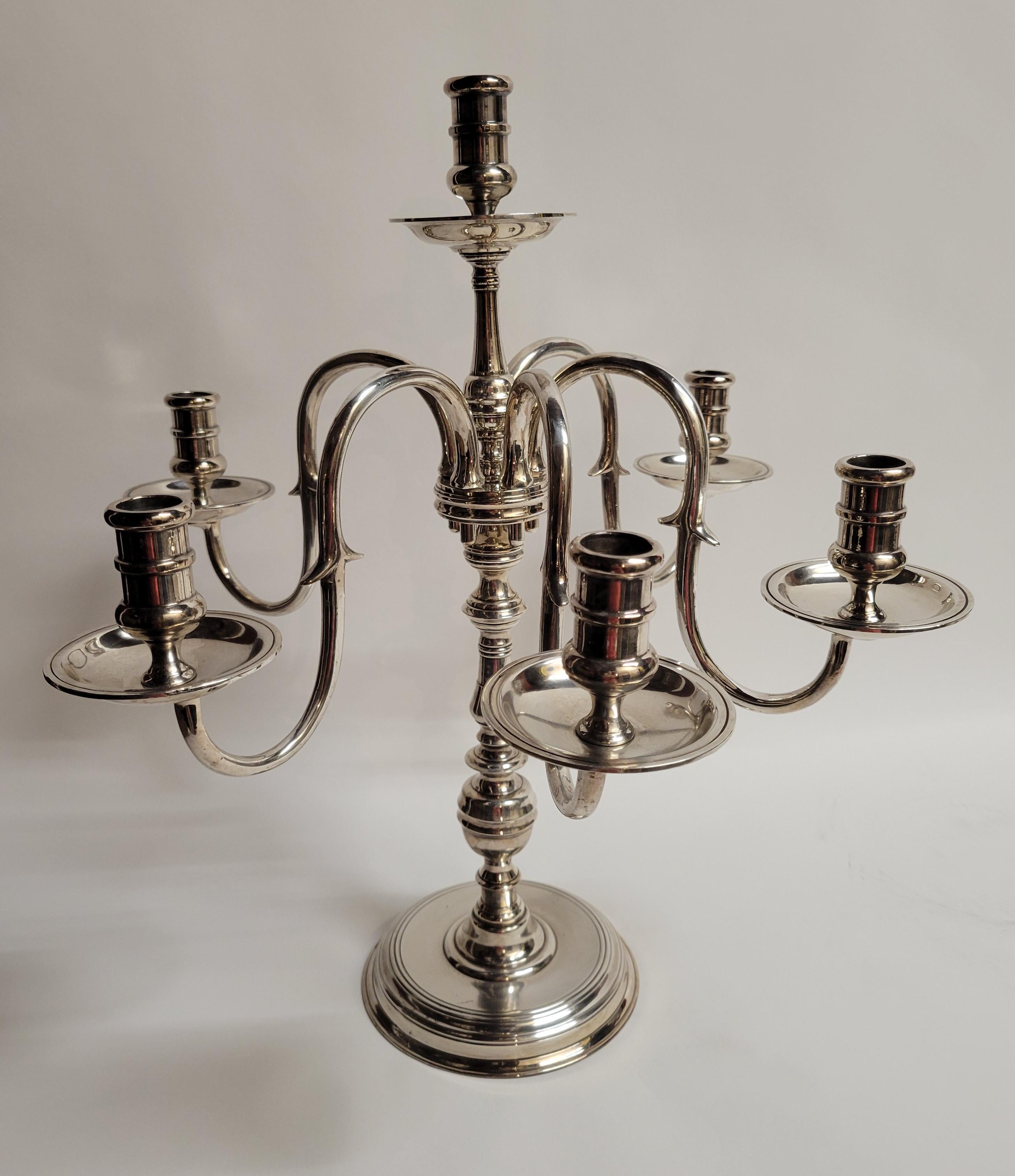 A handsome pair of 5 arm candelabra. Classic lines that would work in any situation.