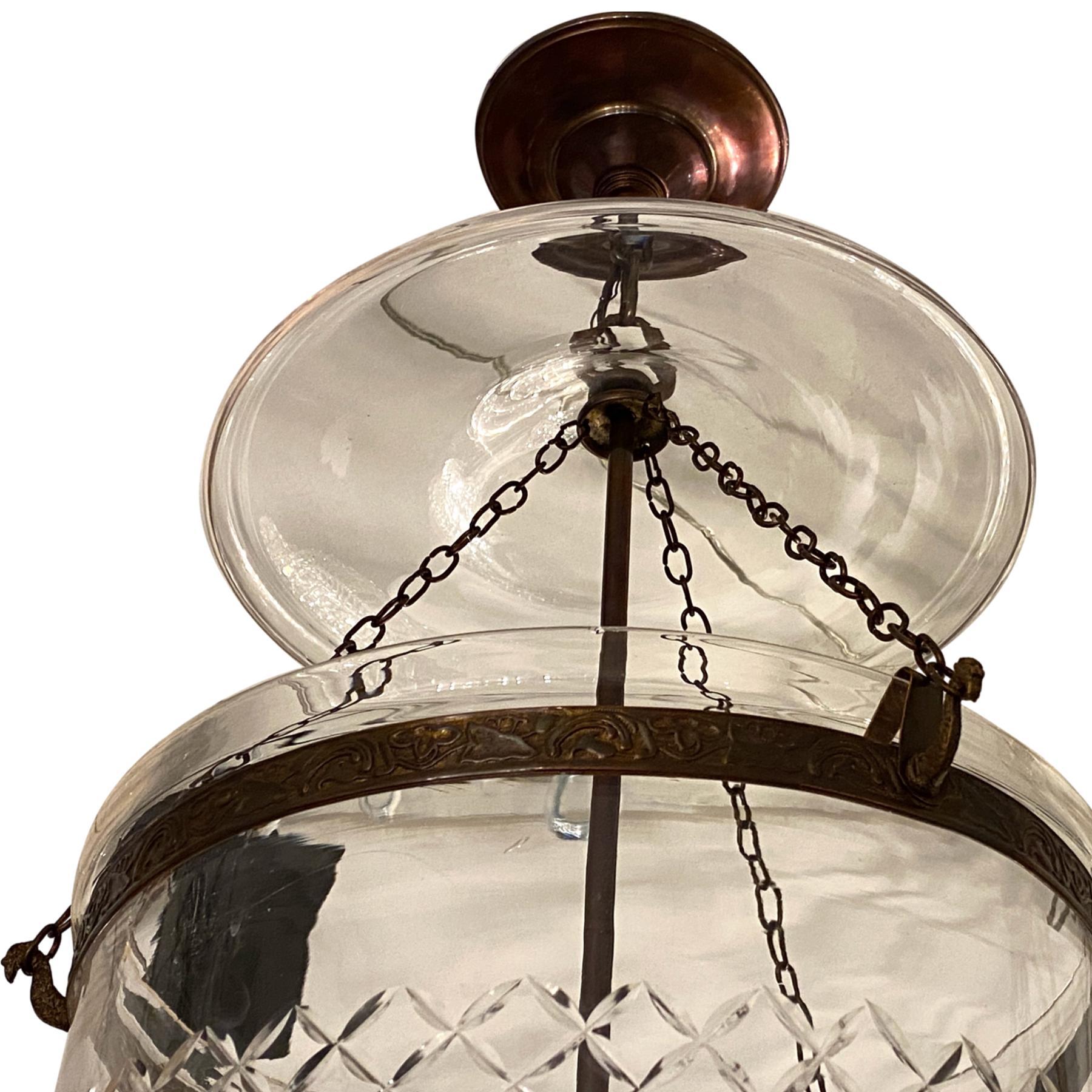 A pair of circa 1940's English etched glass lanterns with original smoke bell and bronze hardware. Sold individually.

Measurements:
Current drop: 31