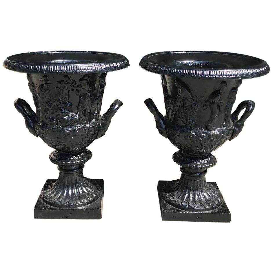 Pair of English Figural Frieze Cast Iron Powder Coated Campana-Form Urns. C 1880
