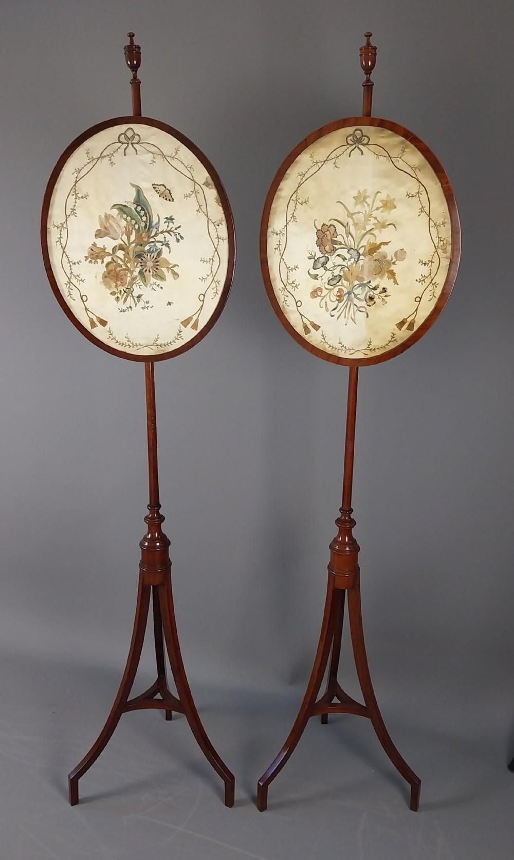 Pair of Antique Mahogany Pole Fire Screens each with oval embroidered silk panels which can be adjusted in height with a brass thumb screw fittings on turned supports and swept elegant legs. English
Dateline of this antique is 19th Century
Height is