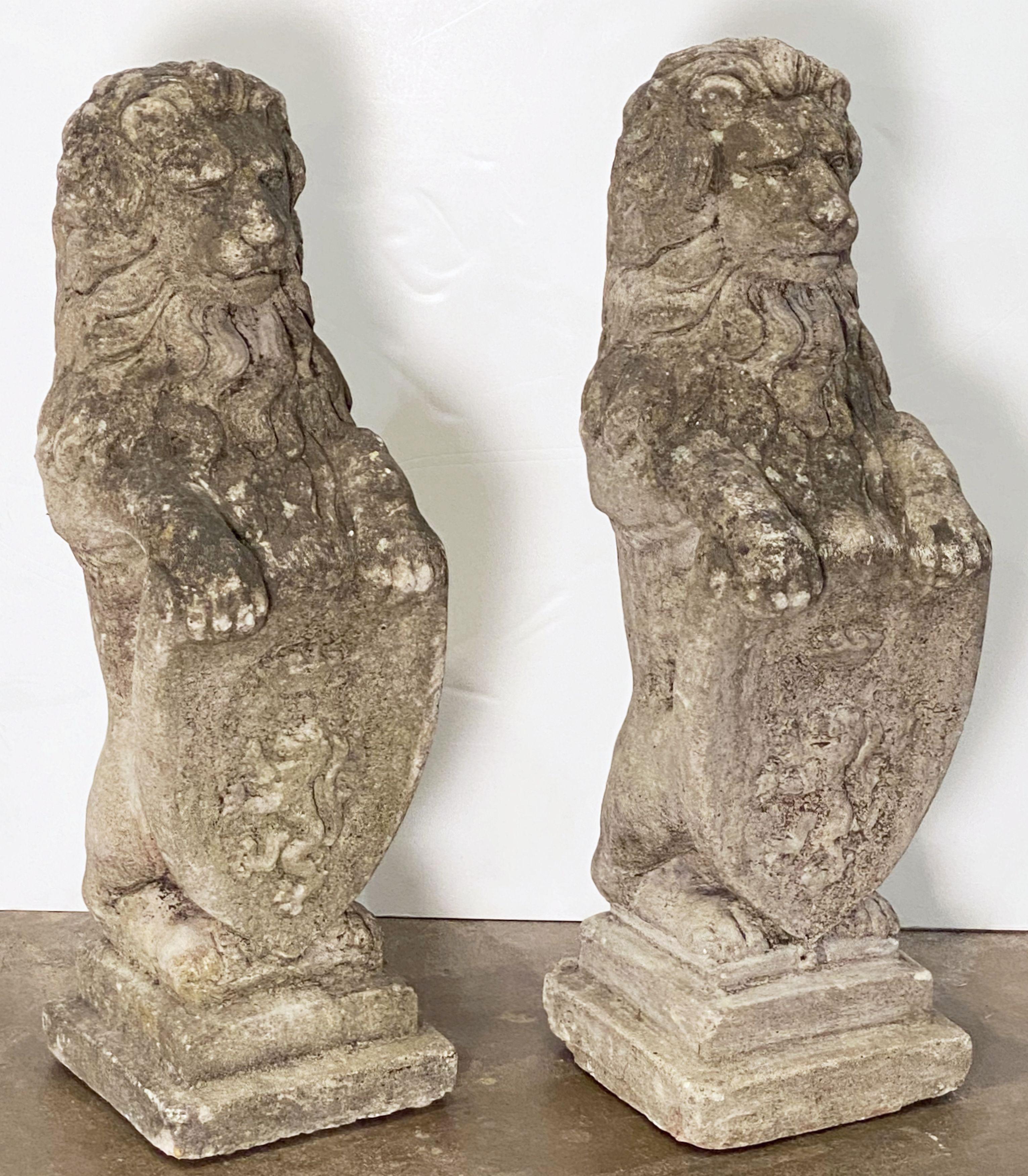 20th Century Pair of English Garden Stone Standing Lion Statues with Heraldic Shields 