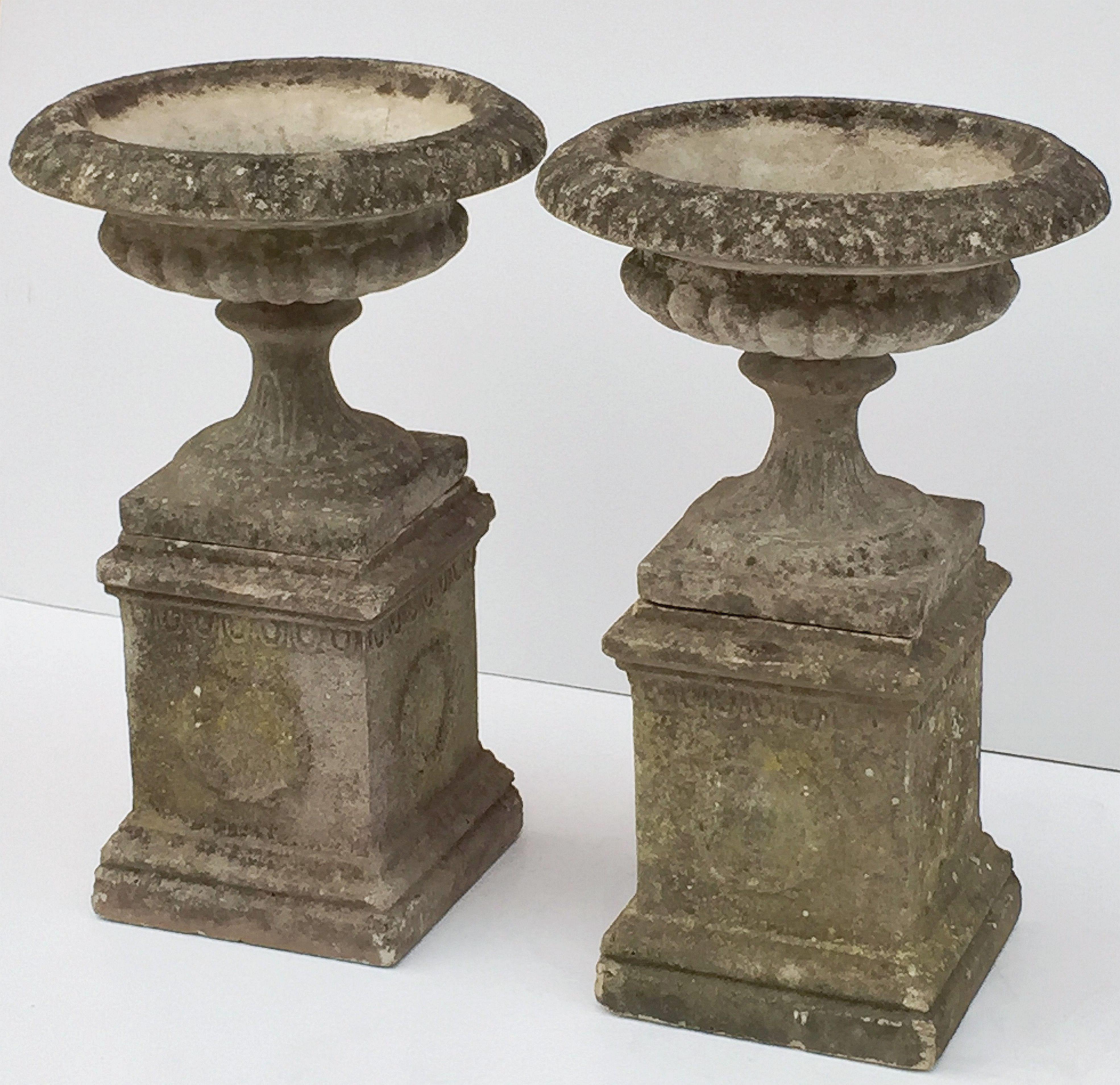 Pair of English Garden Stone Urns on Plinths with Garlands 'Individually Priced' In Excellent Condition In Austin, TX