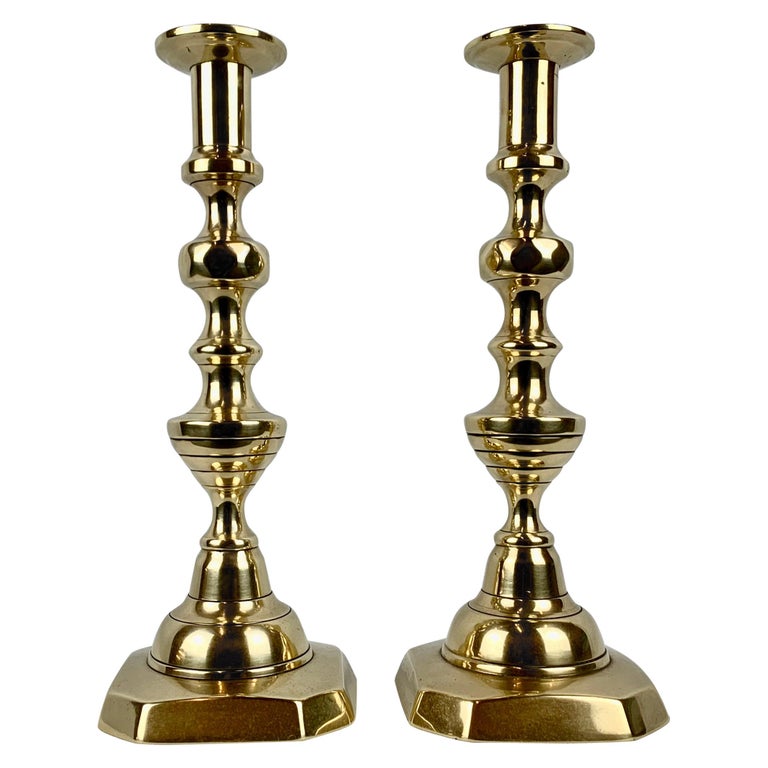 Sold at Auction: SET OF FOUR ENGLISH BRASS PUSH UP CANDLESTICKS.