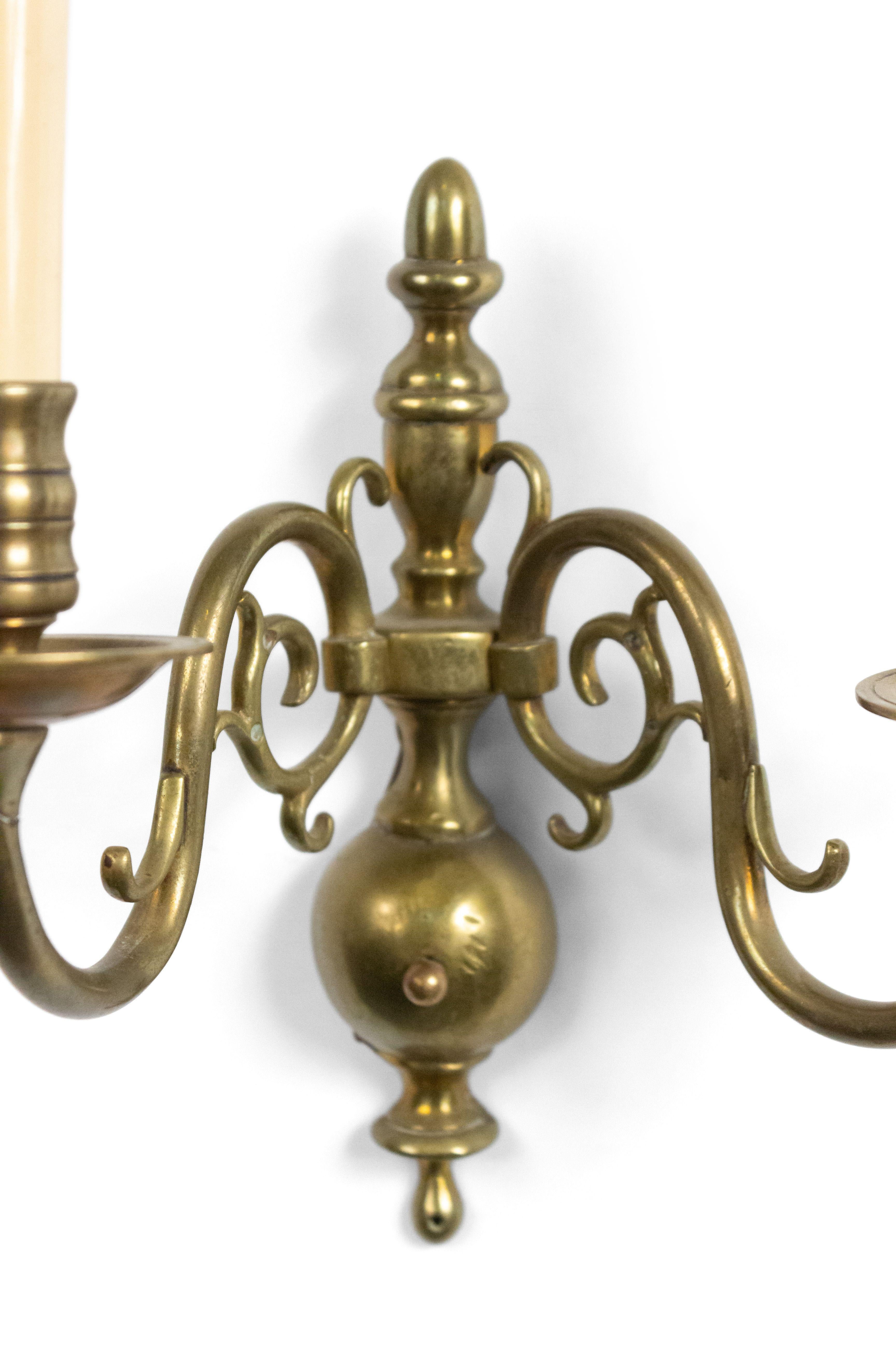 Pair of English Georgian-style (20th Century) brass wall sconces with two scroll arms and slender vasiform back plates (PRICED AS PAIR).
 