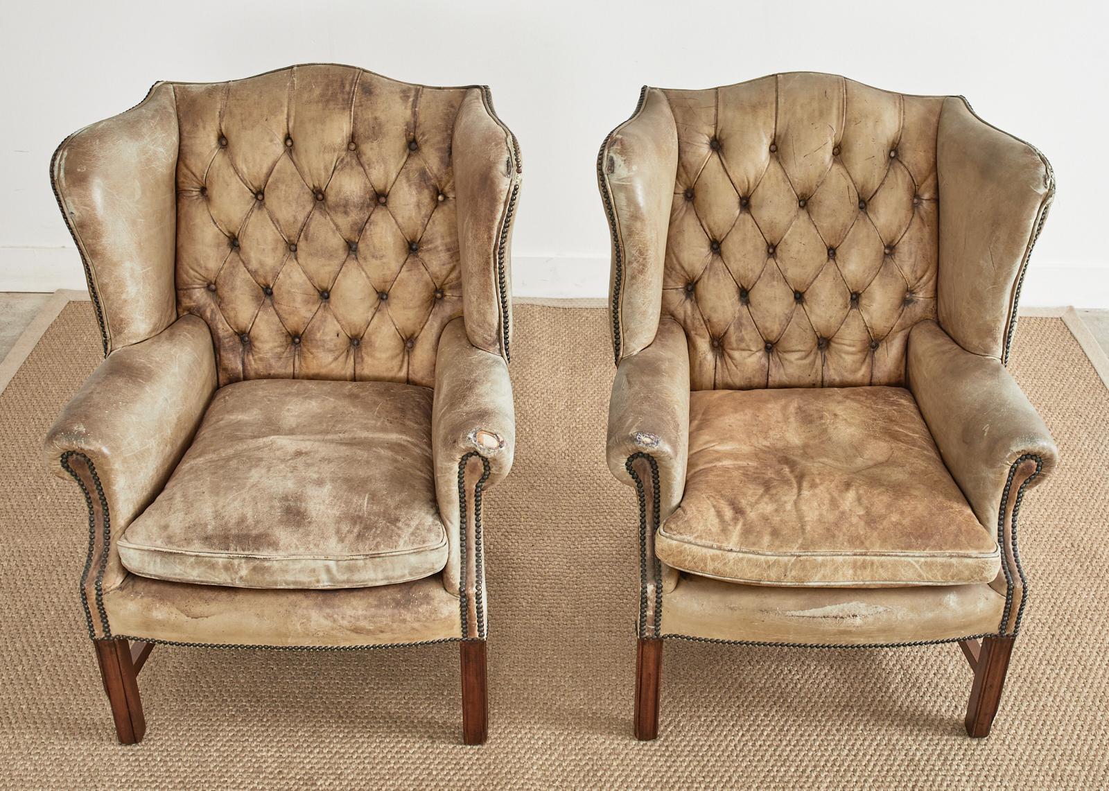 Patinated Pair of English Georgian Cigar Leather Wingback Library Chairs For Sale