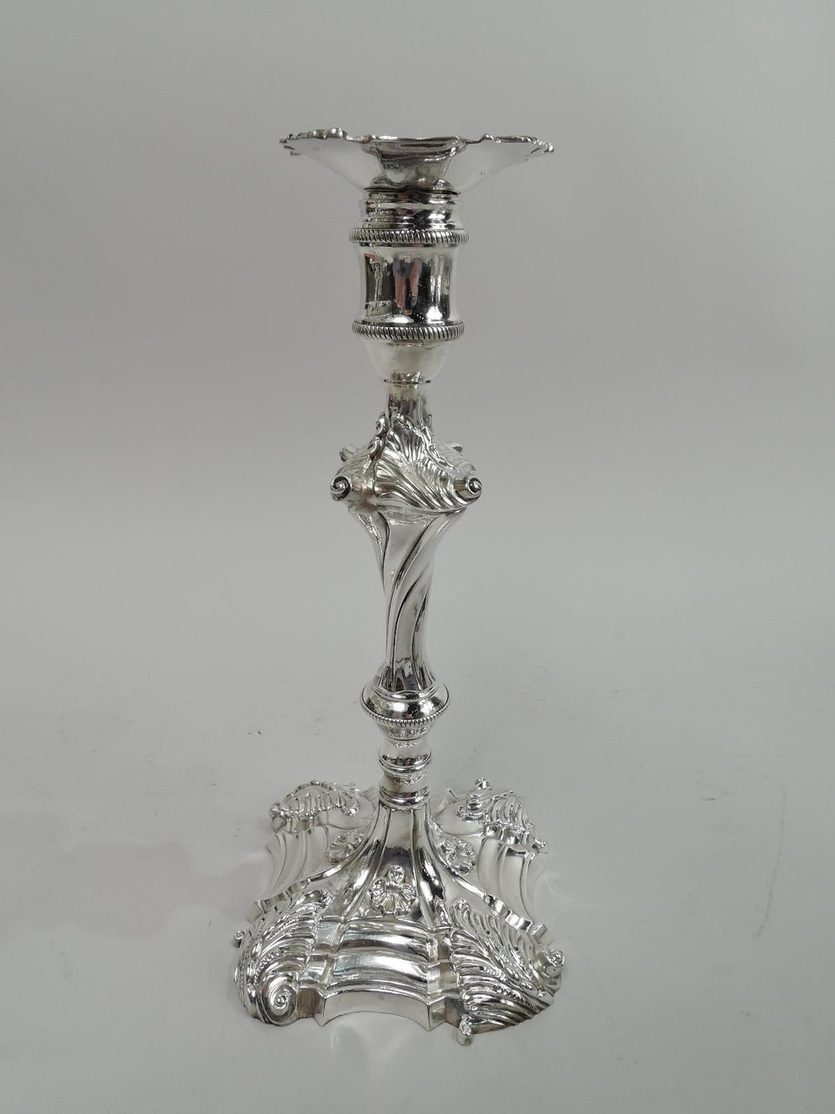 Pair of George III cast sterling silver candlesticks. Made by William Cafe in London in 1761. Each: Twisted and knopped baluster shaft on stepped and shaped square base. Spool socket with detachable bobeche. Applied scallop shells, palmettes, and