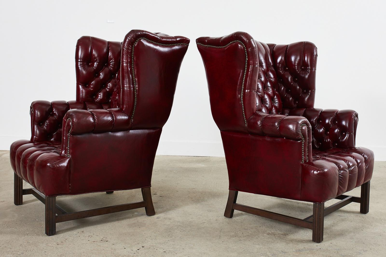 American Pair of English Georgian Style Bonded Leather Tufted Wingback Chairs 