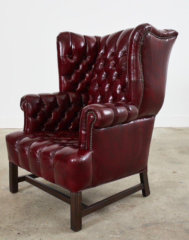 Pair of English Style Bonded Leather Tufted Wingback Chairs at