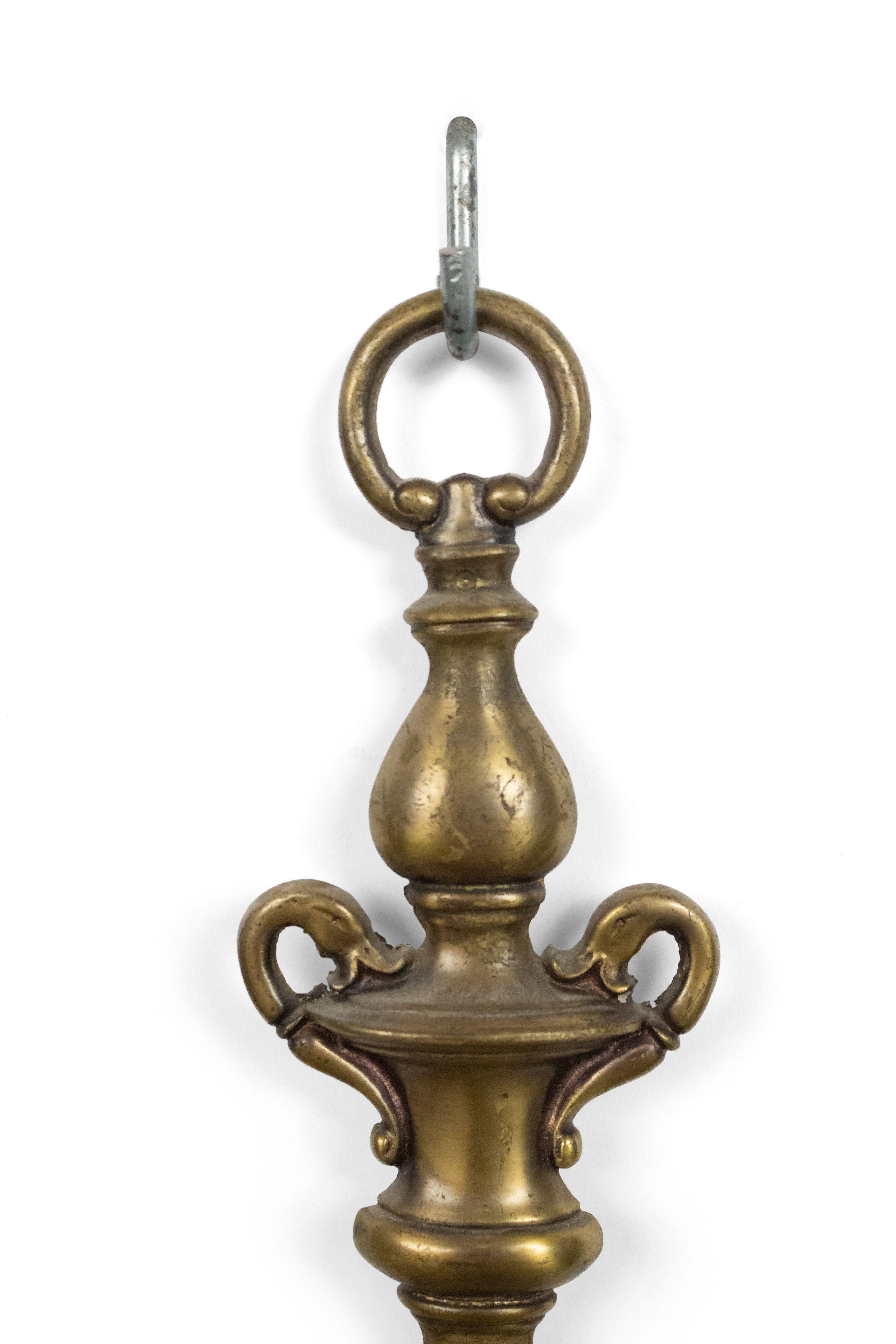 Pair of English Georgian style (20th Century) brass wall sconces with two arms and vasiform backplates. (PRICED AS PAIR).
 