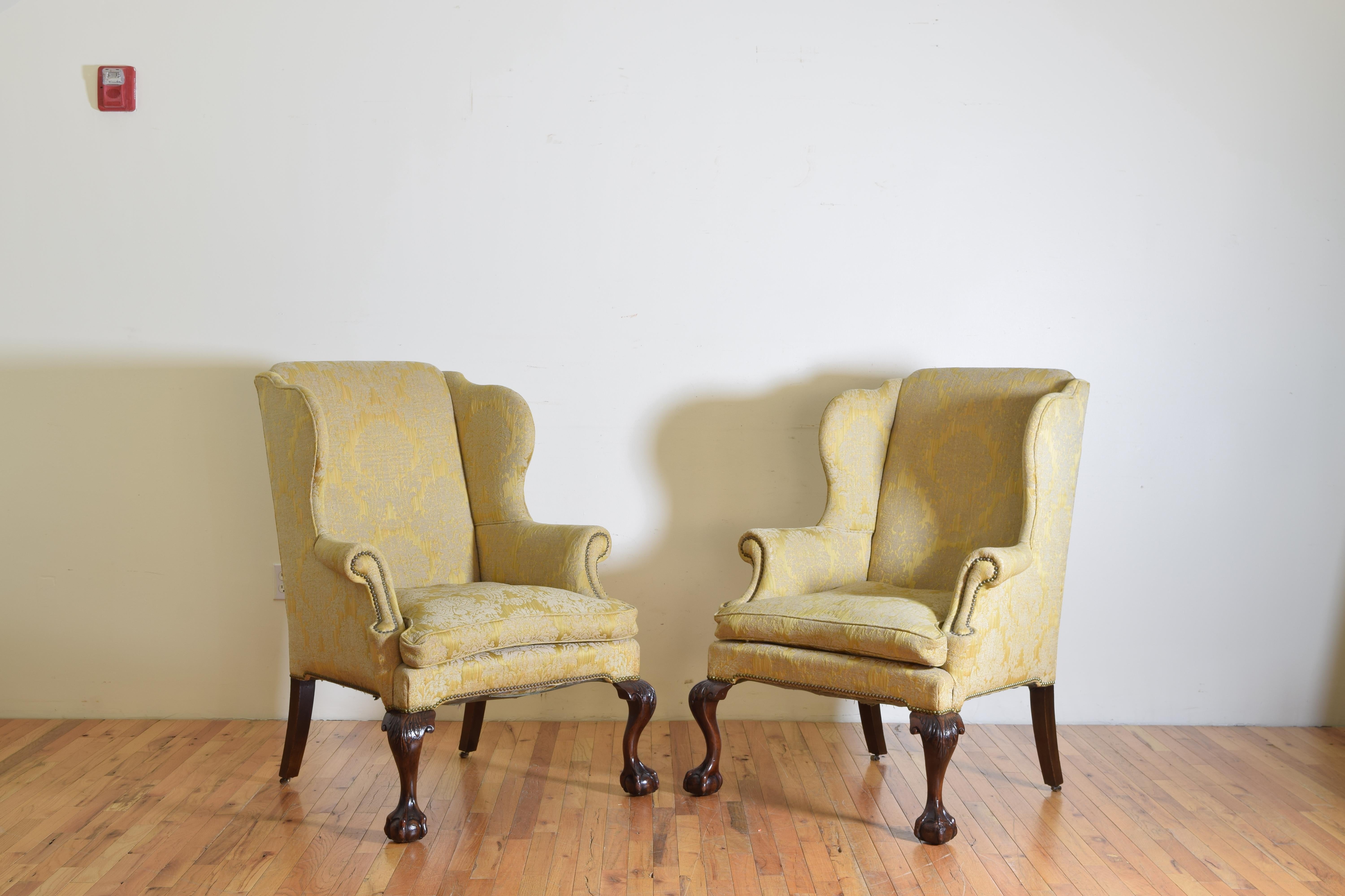Having generous frames and upholstered with loose down cushions these classics are extremely comfortable and have excellent carved feet, retaining original small brass casters on rear legs.