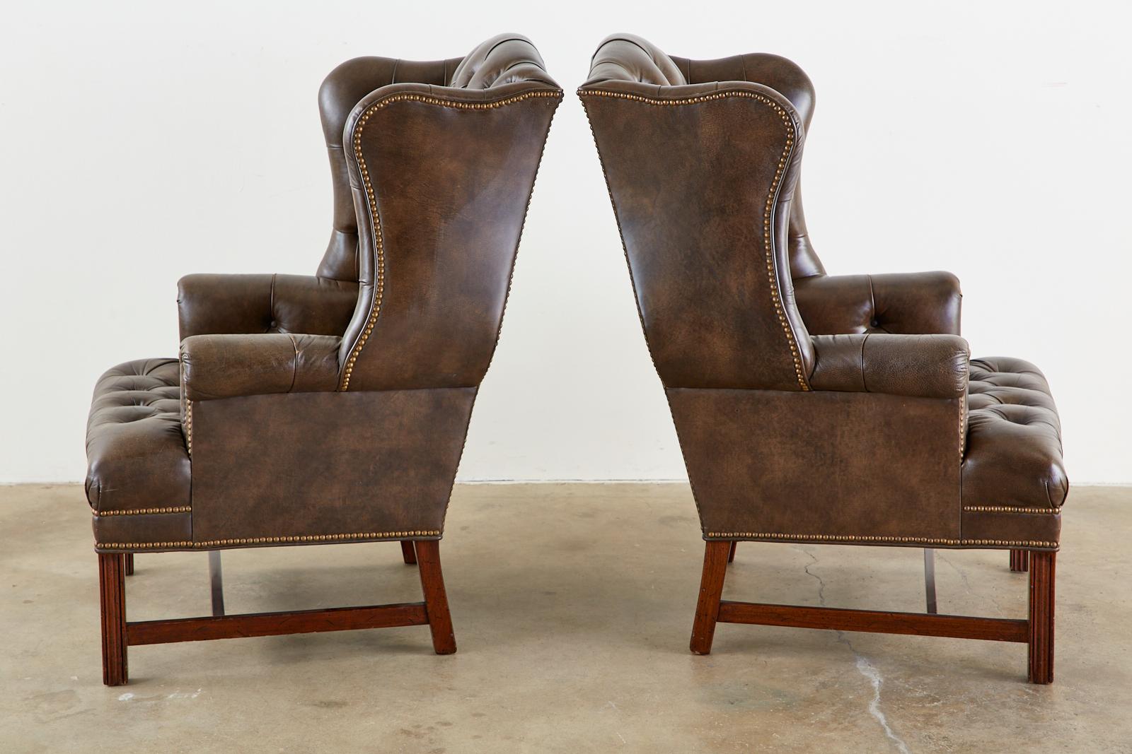 20th Century Pair of English Georgian Style Tufted Leather Wingbacks with Ottoman