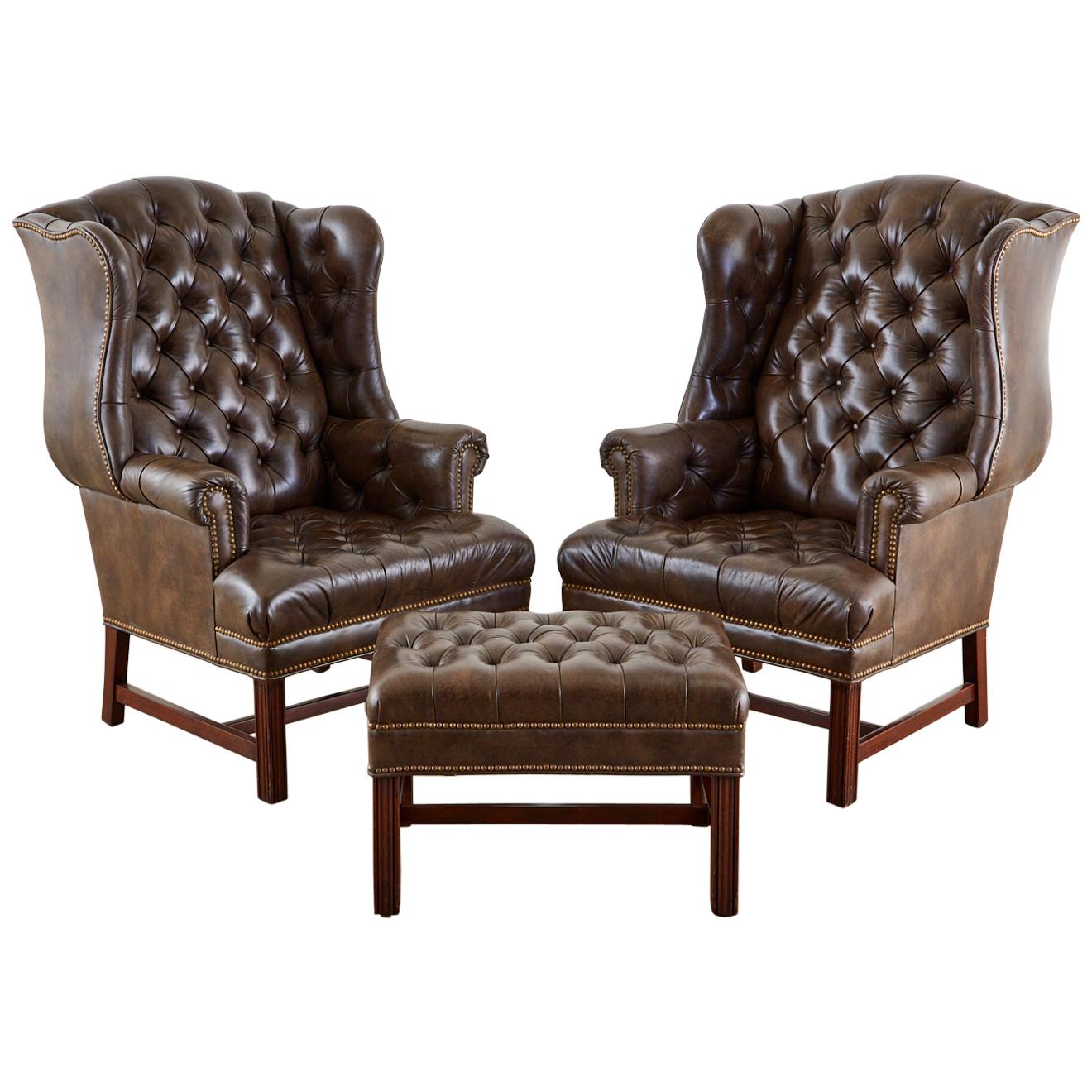 Pair of English Georgian Style Tufted Leather Wingbacks with Ottoman