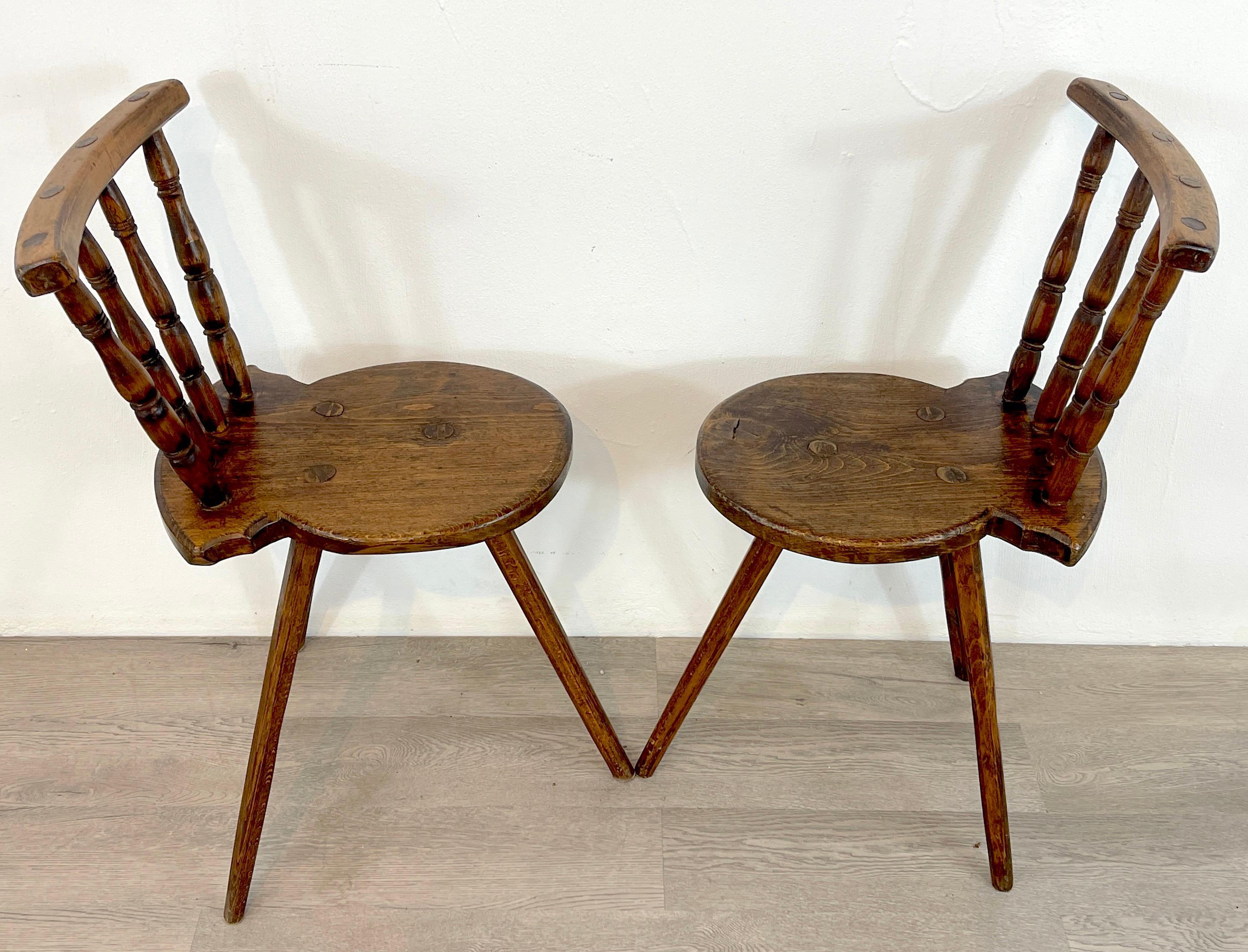 Pair of English Georgian Tripod Captain's chairs, each one of simple design, uniquely shaped with dowel and dovetail construction. Structurally sound.
