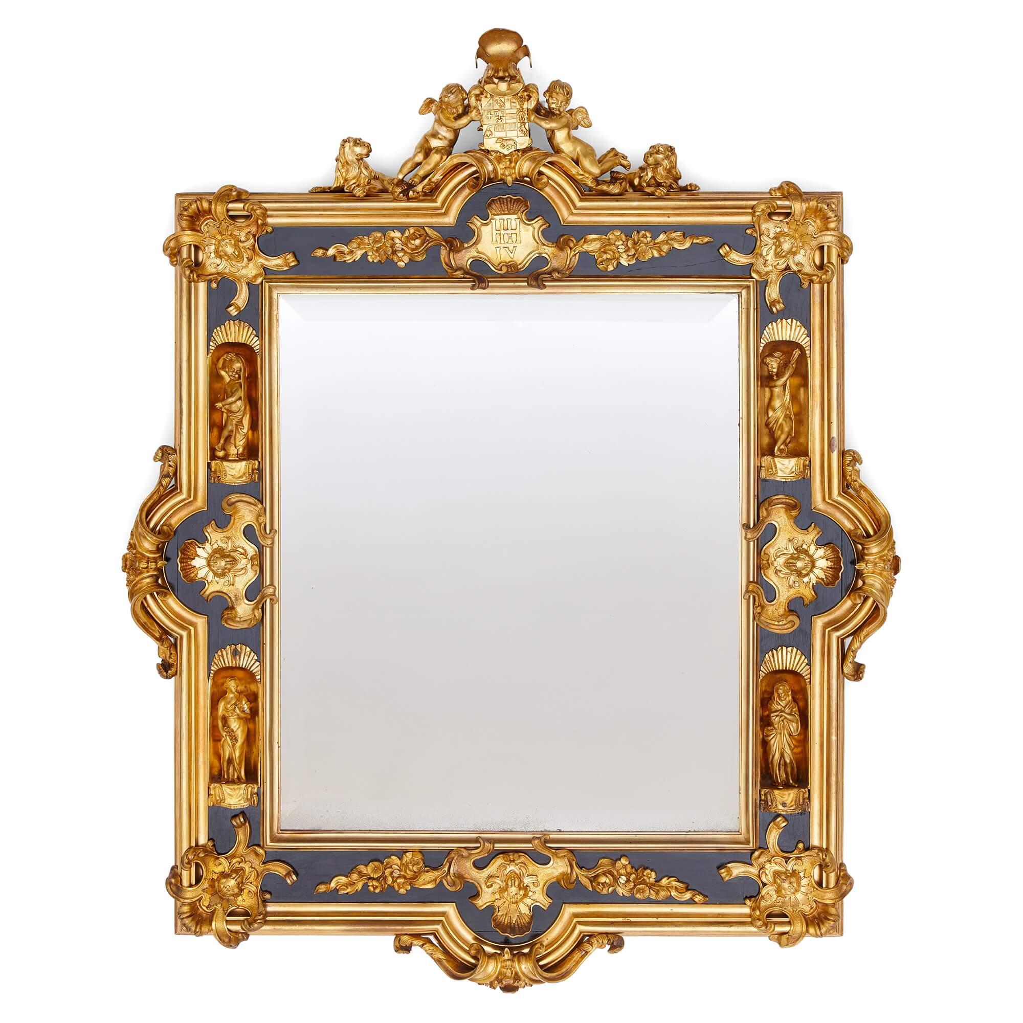 Pair of English gilt bronze and ebonised wood mirrors 
English, c. 1860
Height 74cm, width 59cm, depth 7cm 

Magnificently crafted in around 1860 by English craftsmen, this pair of mirrors is decorated with several motifs, some inspired by French
