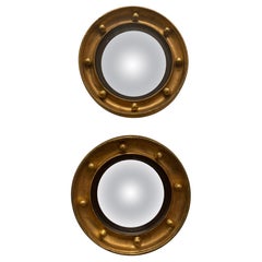 Paire de miroirs anglais à œil de taureau encadrés et dorés, 19e/20e siècle