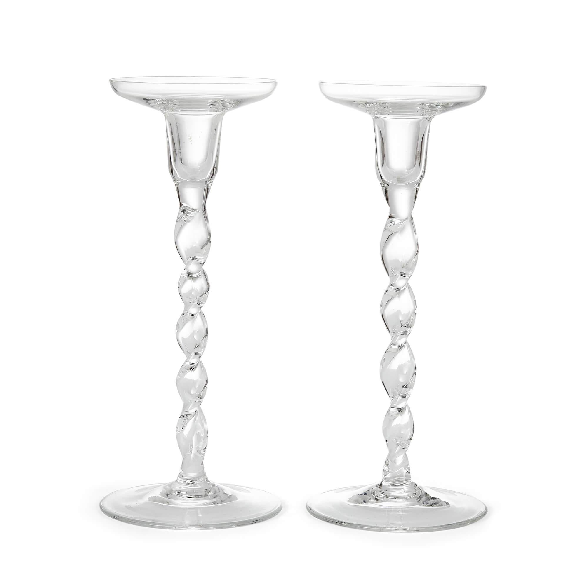 Pair of English glass spiral-twisted candlesticks
English, early 20th century
Measures: height 25cm, diameter 11cm

Made in England in the early part of the twentieth century, these elegant glass candlesticks stand out for their beautifully