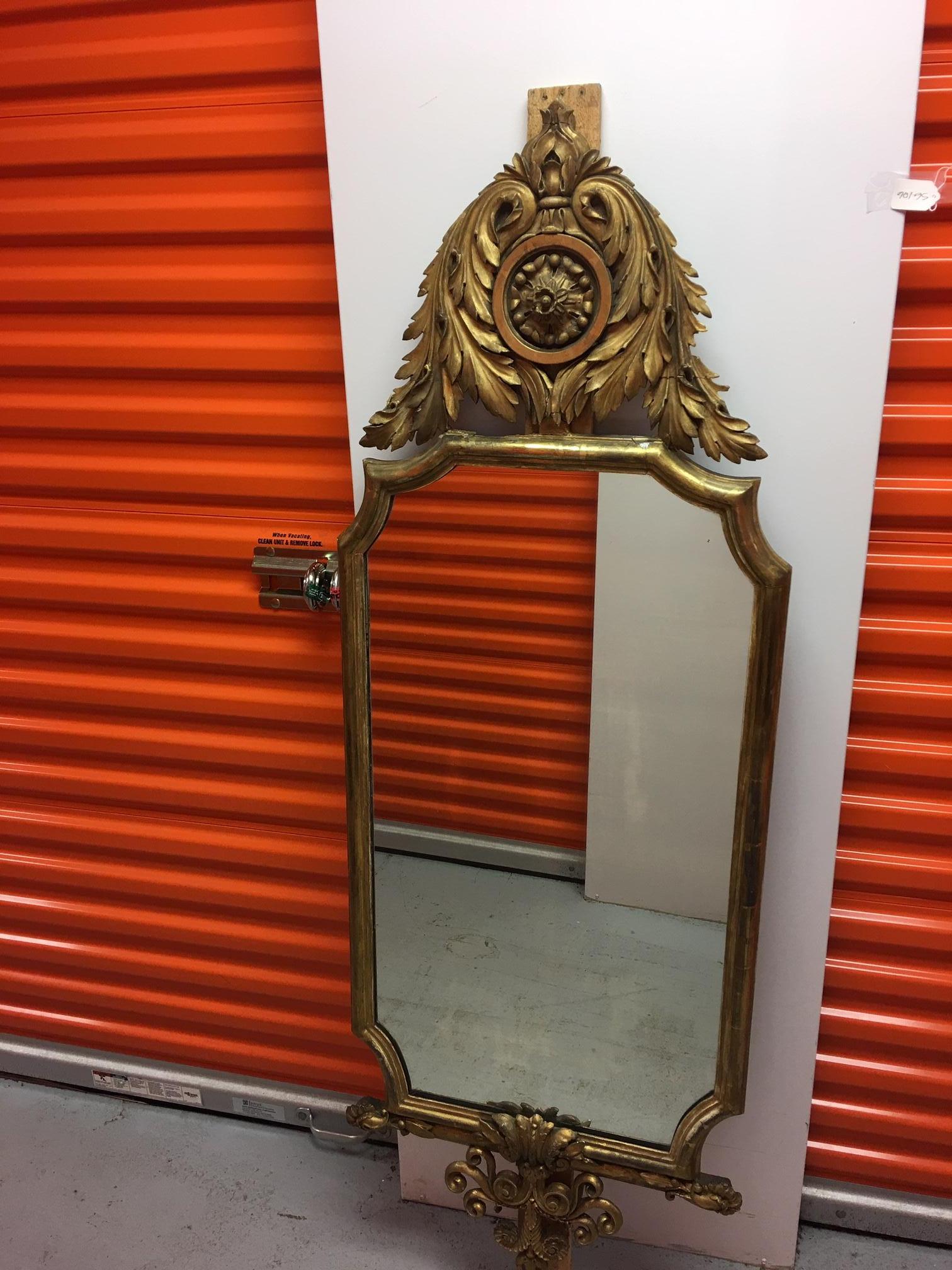 Pair of English gold leaf mirrors with acanthus leaves and scrolls, 19th century.