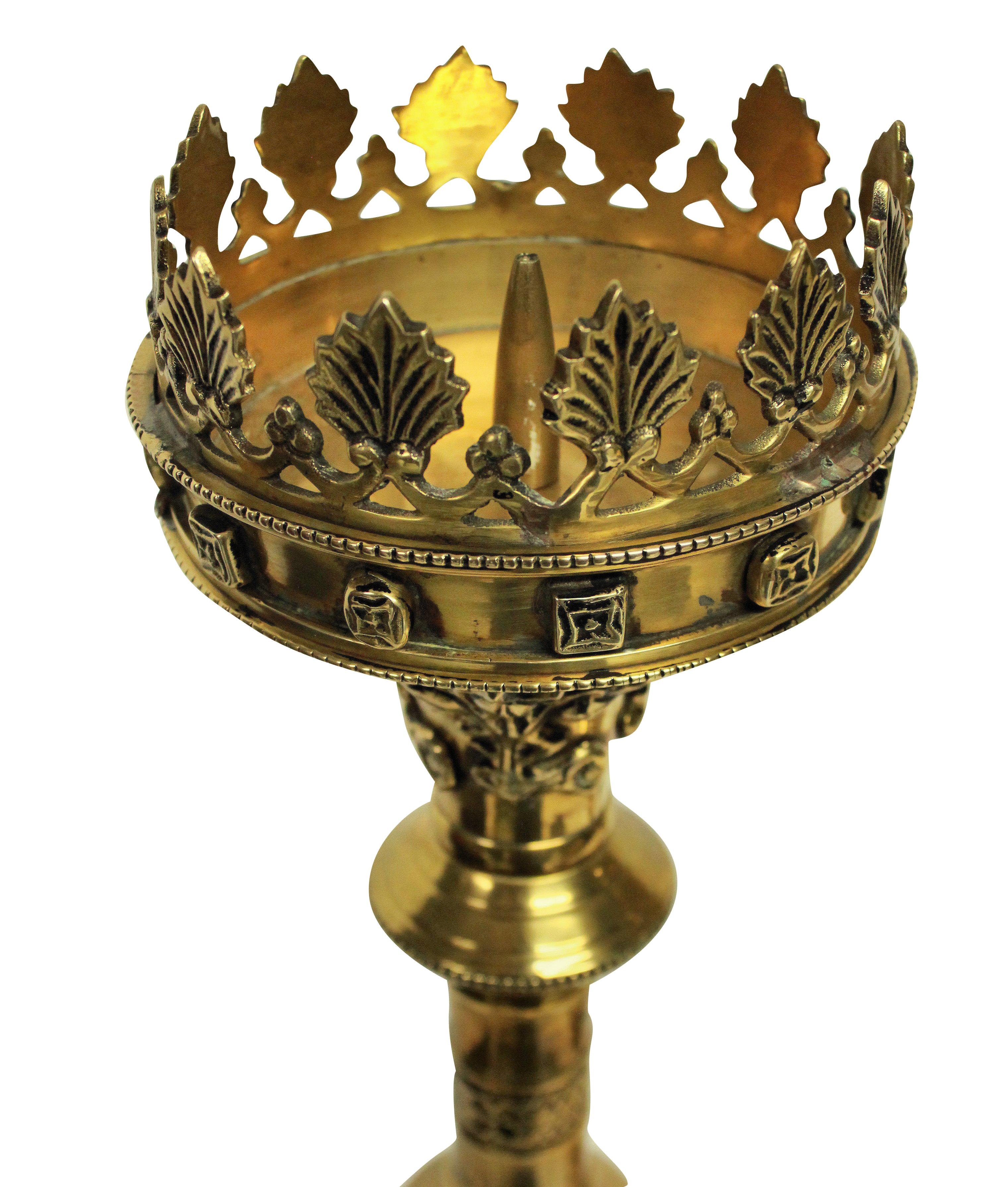 A good pair of English Gothic Revival gilt brass candlesticks in the manner of Pugin. With good crisp detail and traces of black paint, probably from Queen Victoria's death and mourning period.