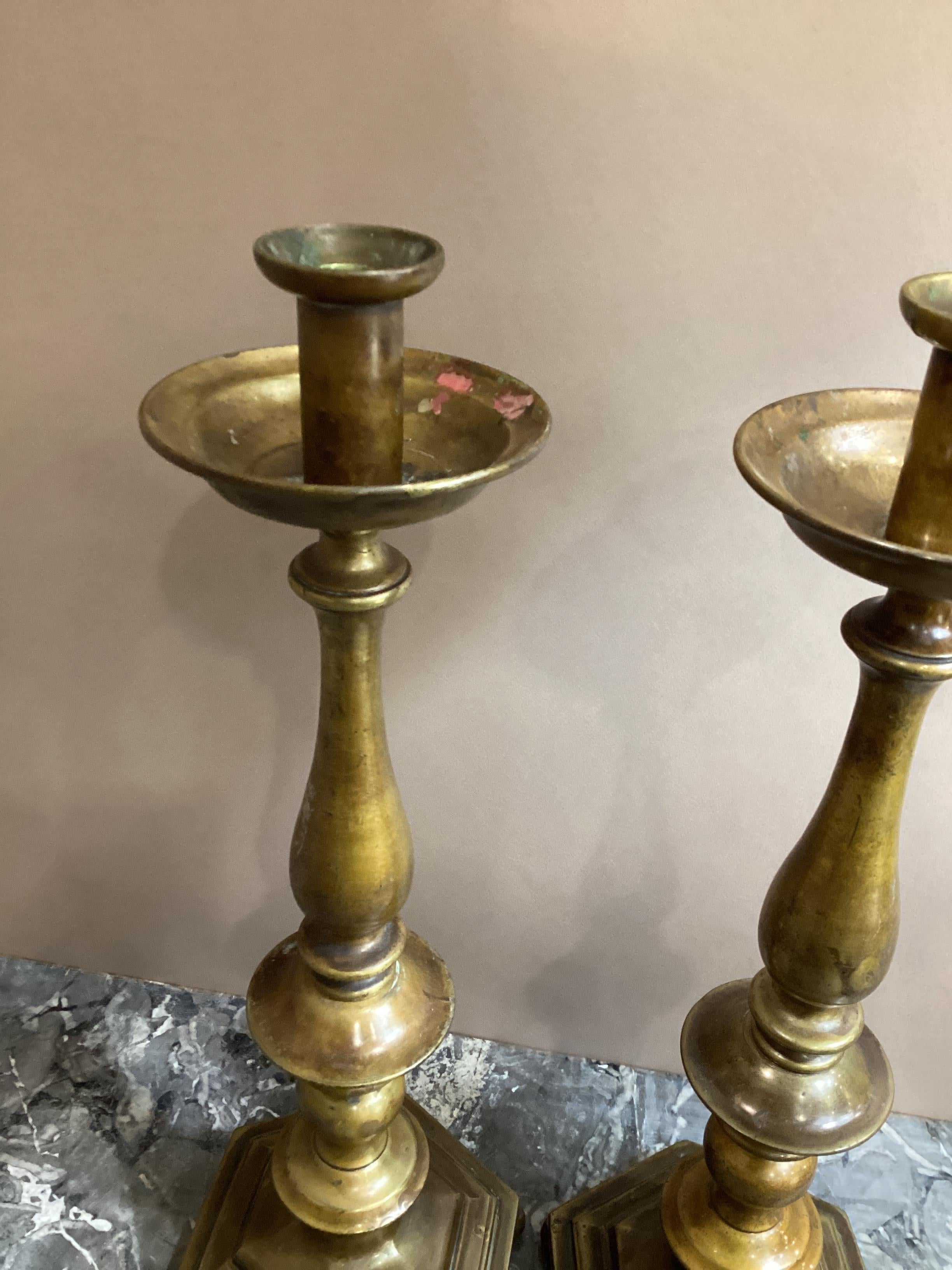 Pair of English Hexagonal Base Brass Candlesticks. Stamped on base “Made in England “ These can be polished to a high shine which we can provide free of charge.