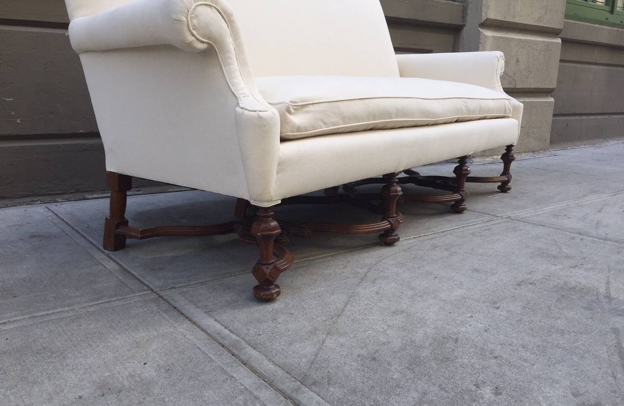 Carved Pair of English High Back Antique Walnut Sofas in Linen For Sale