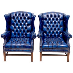 Pair of English Hollywood Regency blue leather Wing Back Chesterfield Chairs