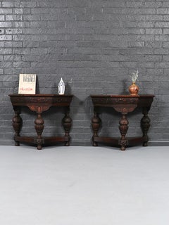 Pair of English Jacobean Revival Carved Oak Demilune Console Tables